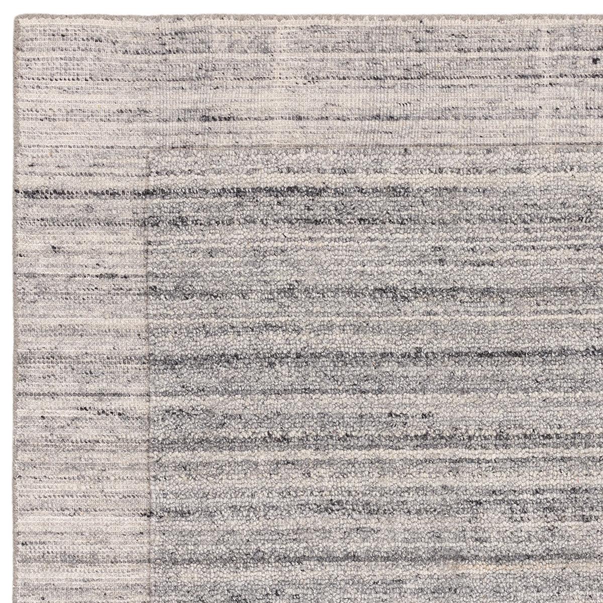 Asiatic Larson Grey Rug featuring abstract striped pattern in charcoal grey, light grey and ivory on soft grey background, hand-tufted wool