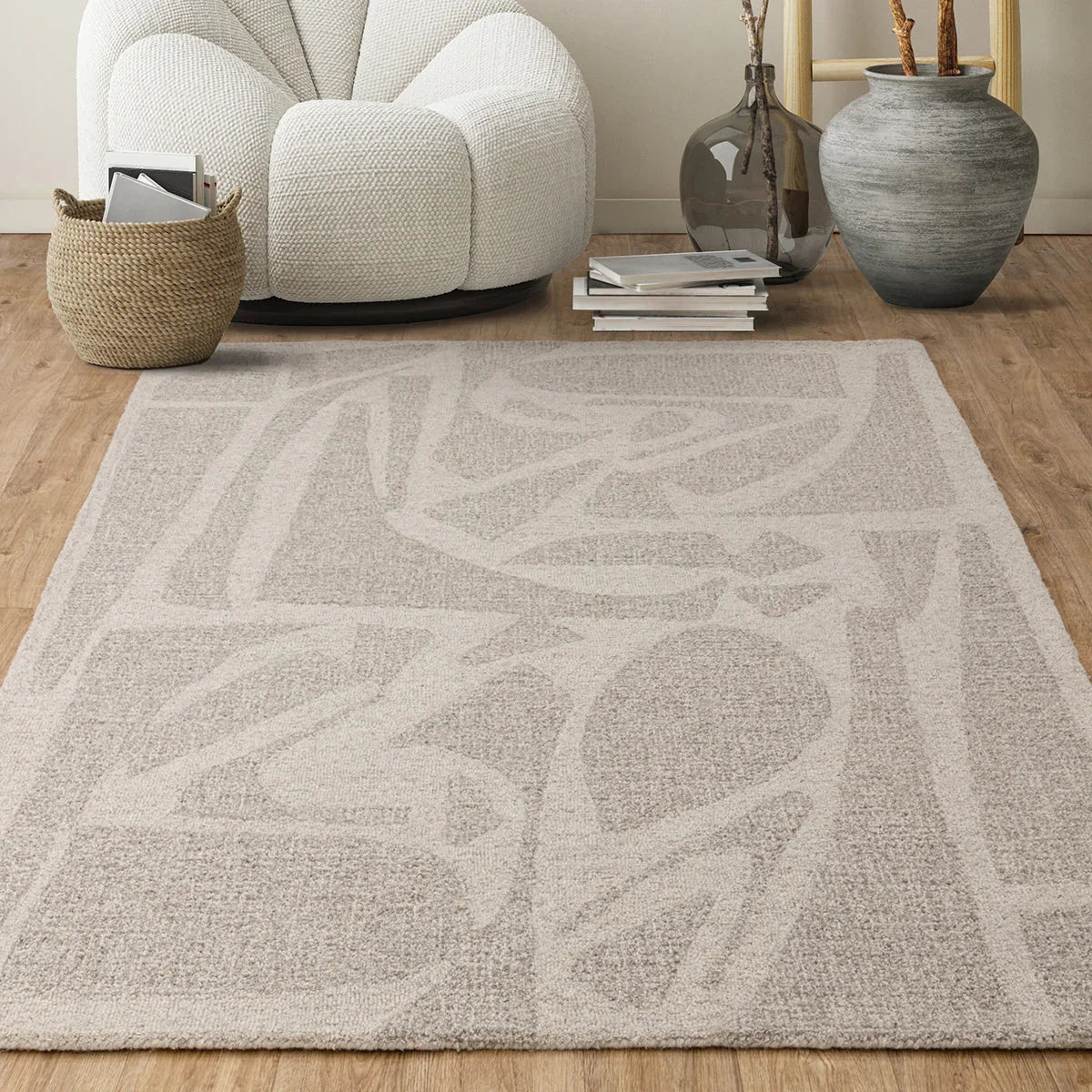 Patterned rug on a wooden floor with a chair and decorative items in the background.