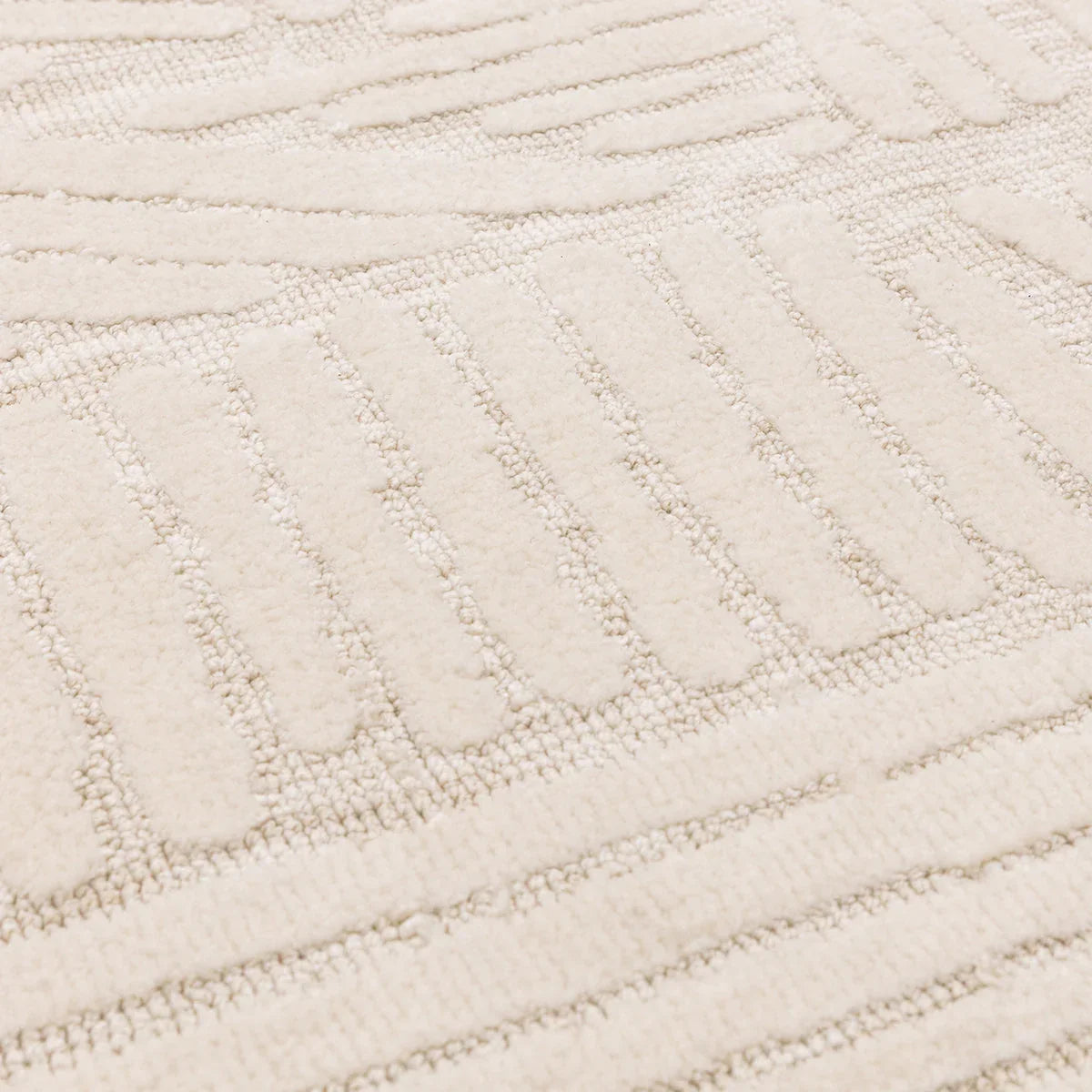Asiatic Mason Trapezium Rug featuring geometric trapezium pattern in cream, beige on pale background, hand-tufted wool