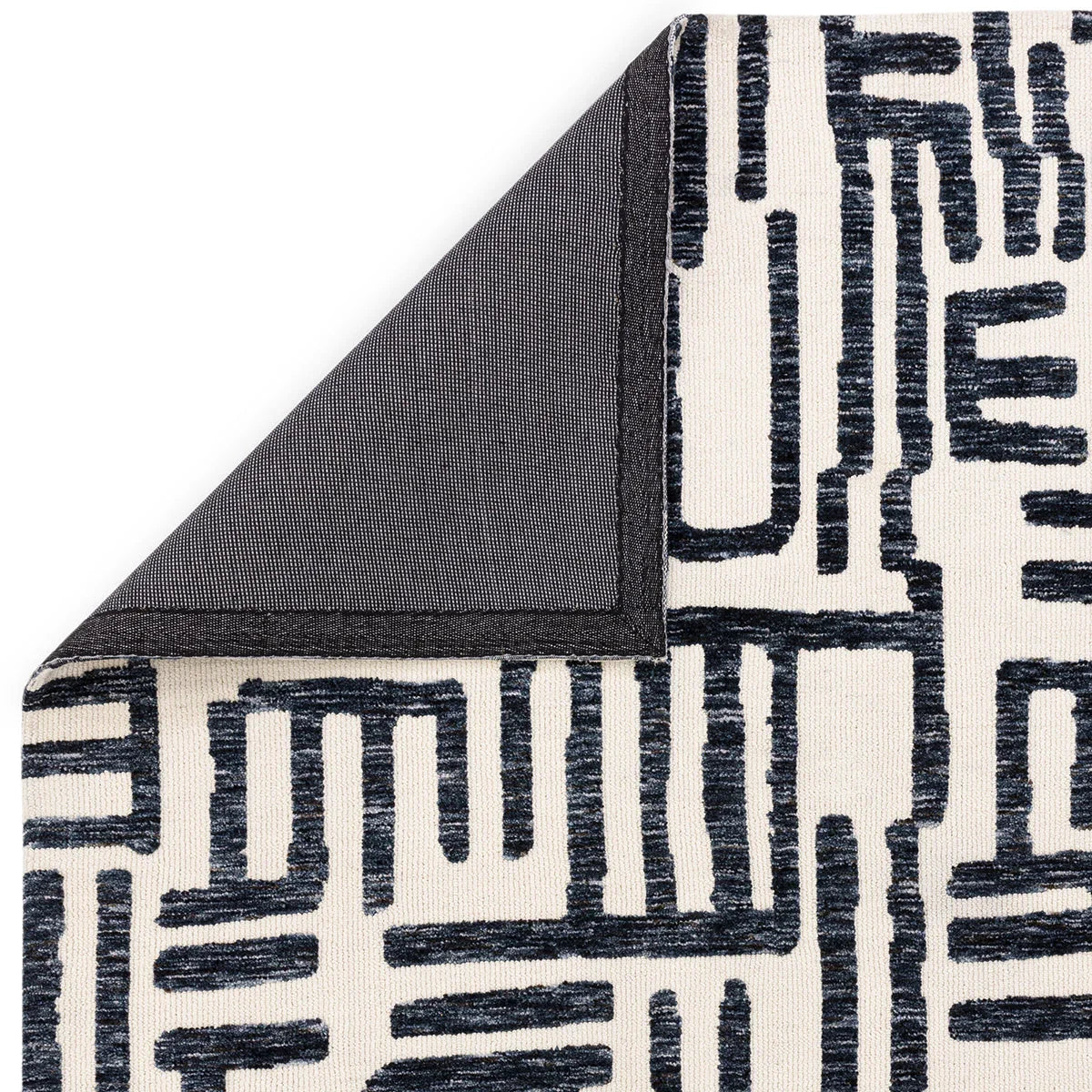 Asiatic Mason Script Designer Rug featuring geometric script pattern in navy blue and charcoal on ivory background, hand-tufted wool
