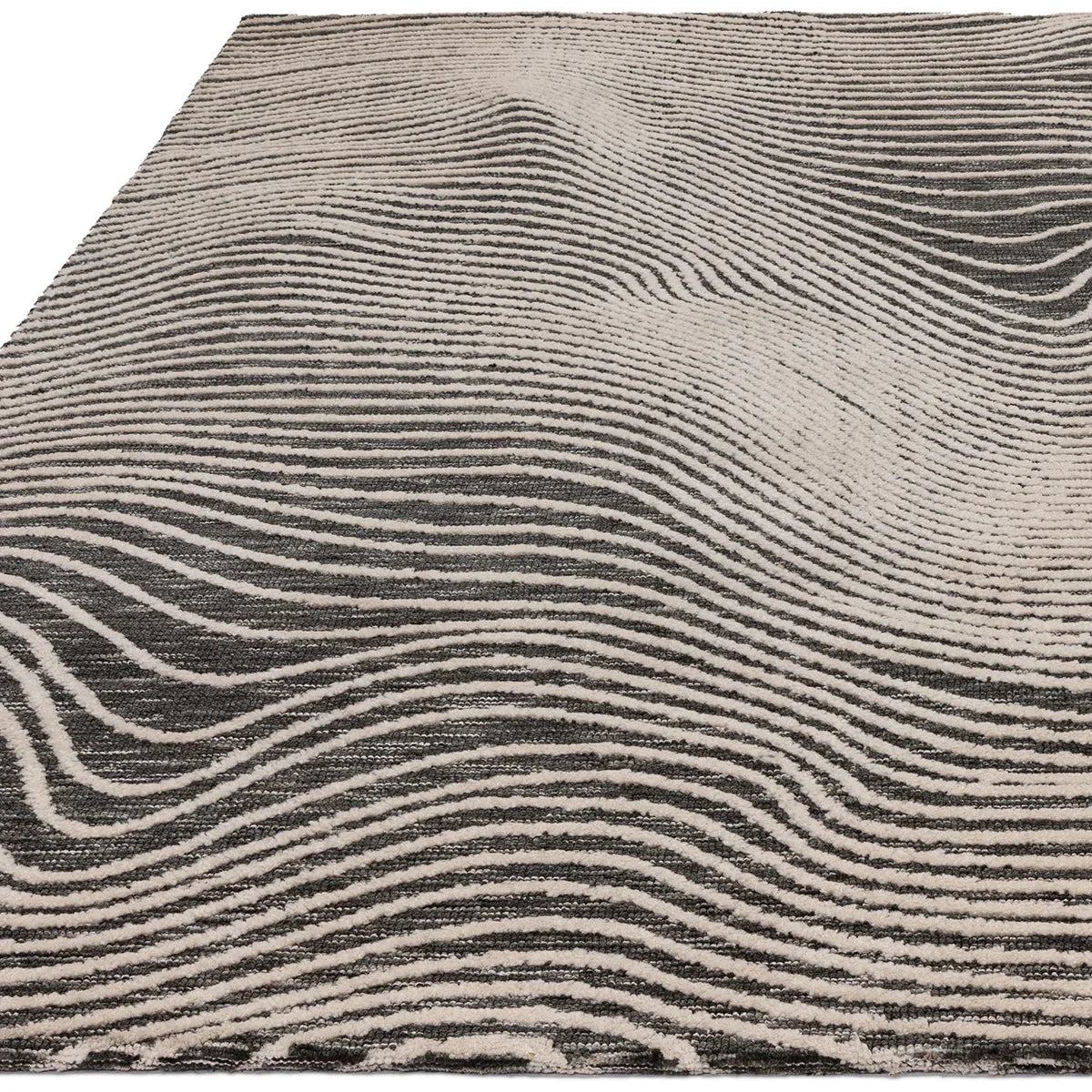 Asiatic Mason Magnitude Black Designer Rug featuring wavy striped pattern in beige, taupe and charcoal on cream background
