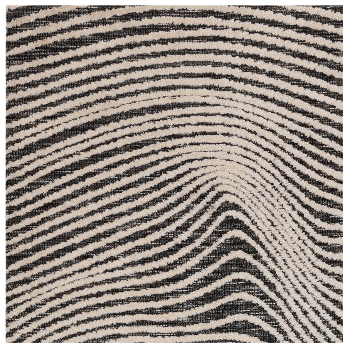 Asiatic Mason Magnitude Black Designer Rug featuring zebra stripe pattern in black, cream on beige background, woven wool