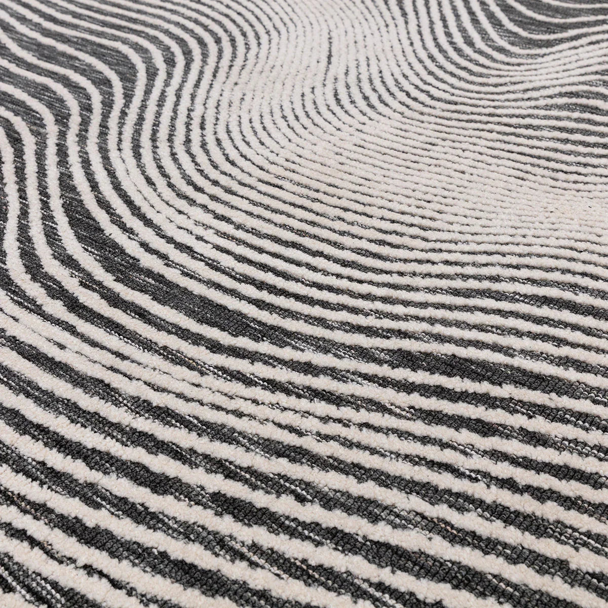Asiatic Mason Magnitude Black Designer Rug featuring zebra-stripe pattern in black and ivory on white background, construction unknown, material unknown