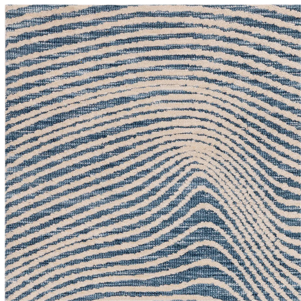 Asiatic Mason Magnitude Blue Rug featuring wavy striped pattern in navy blue, sky blue and cream on ivory background, hand-tufted wool
