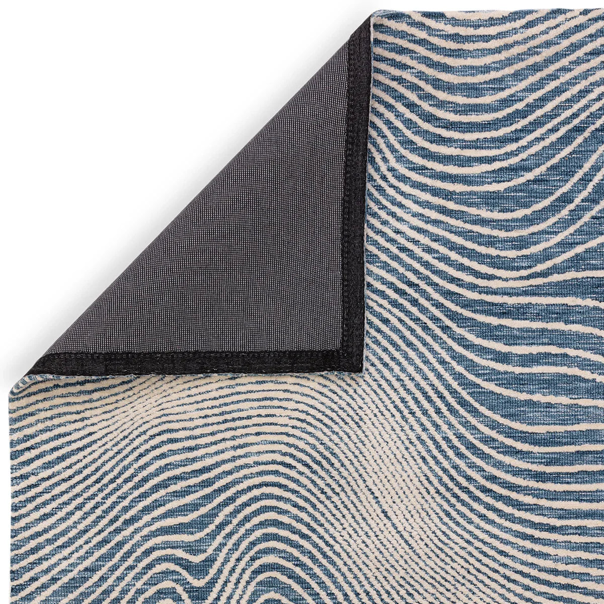 Asiatic Mason Magnitude Blue Designer Rug featuring wavy striped pattern in navy, cream and light blue on pale blue background, hand-tufted wool
