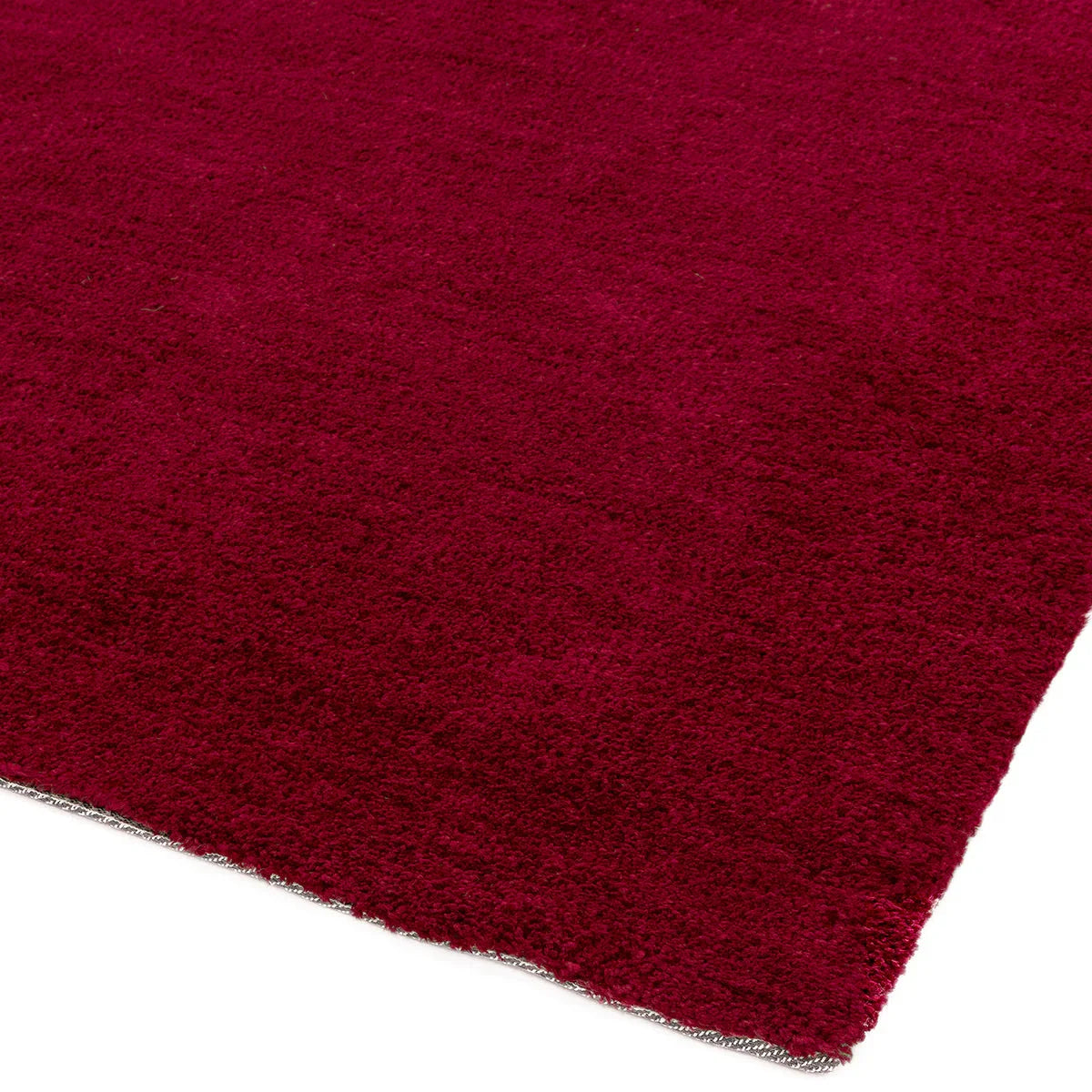 Asiatic Milo Berry Designer Rug featuring solid plush texture in burgundy on light edge, hand-tufted wool