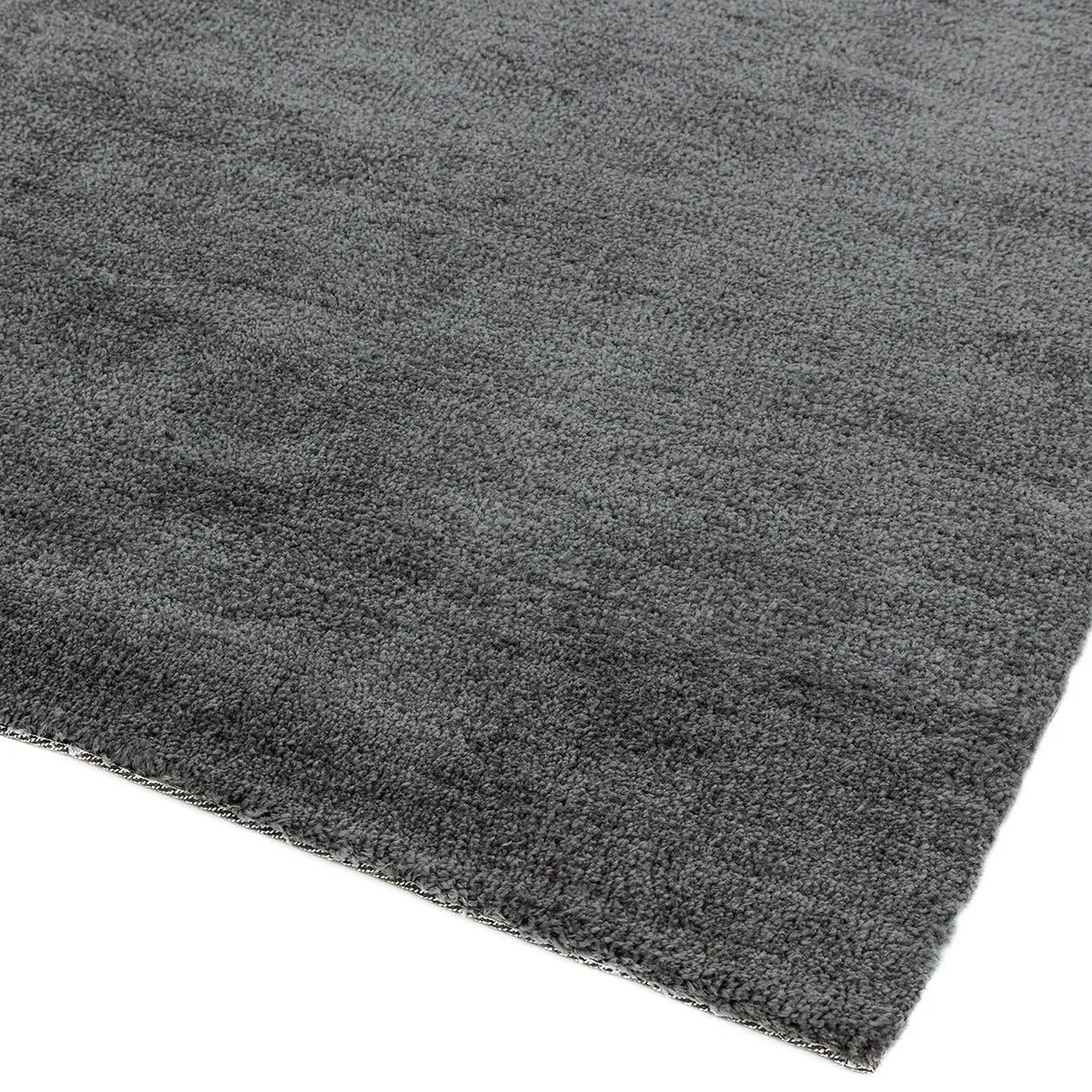 Asiatic Milo Grey Designer Rug featuring solid textured design in charcoal grey, slate grey and light grey on white background, machine-made polypropylene blend