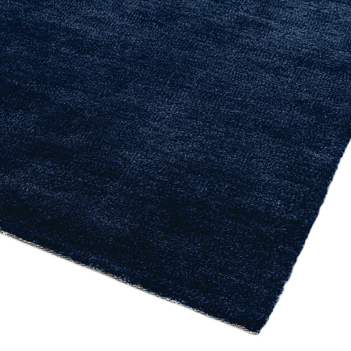 Asiatic Milo Navy Designer Rug featuring solid texture in navy blue on navy background, hand-tufted wool