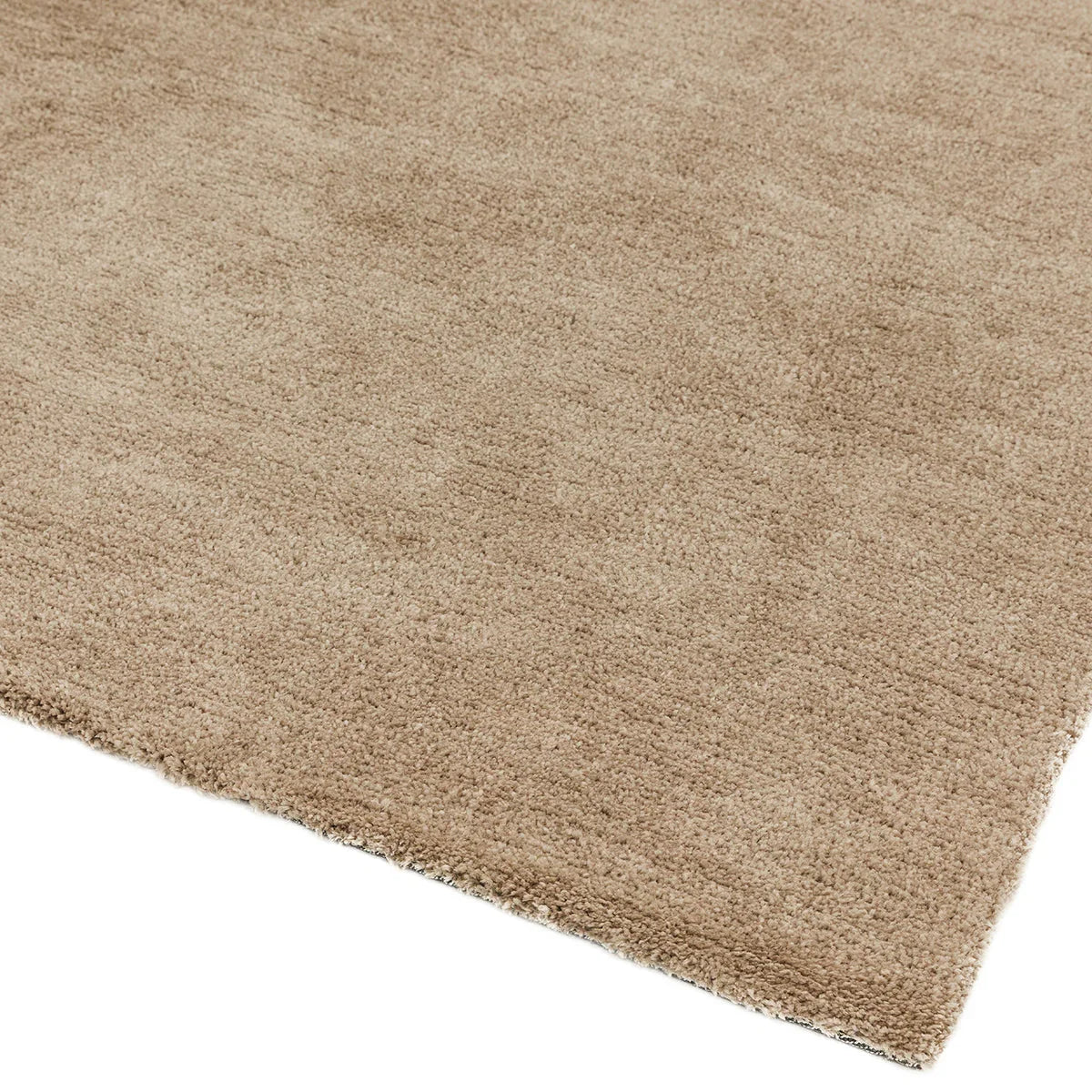Asiatic Milo Sand Designer Rug featuring solid shag in sandy beige on pale background, machine-made polyester