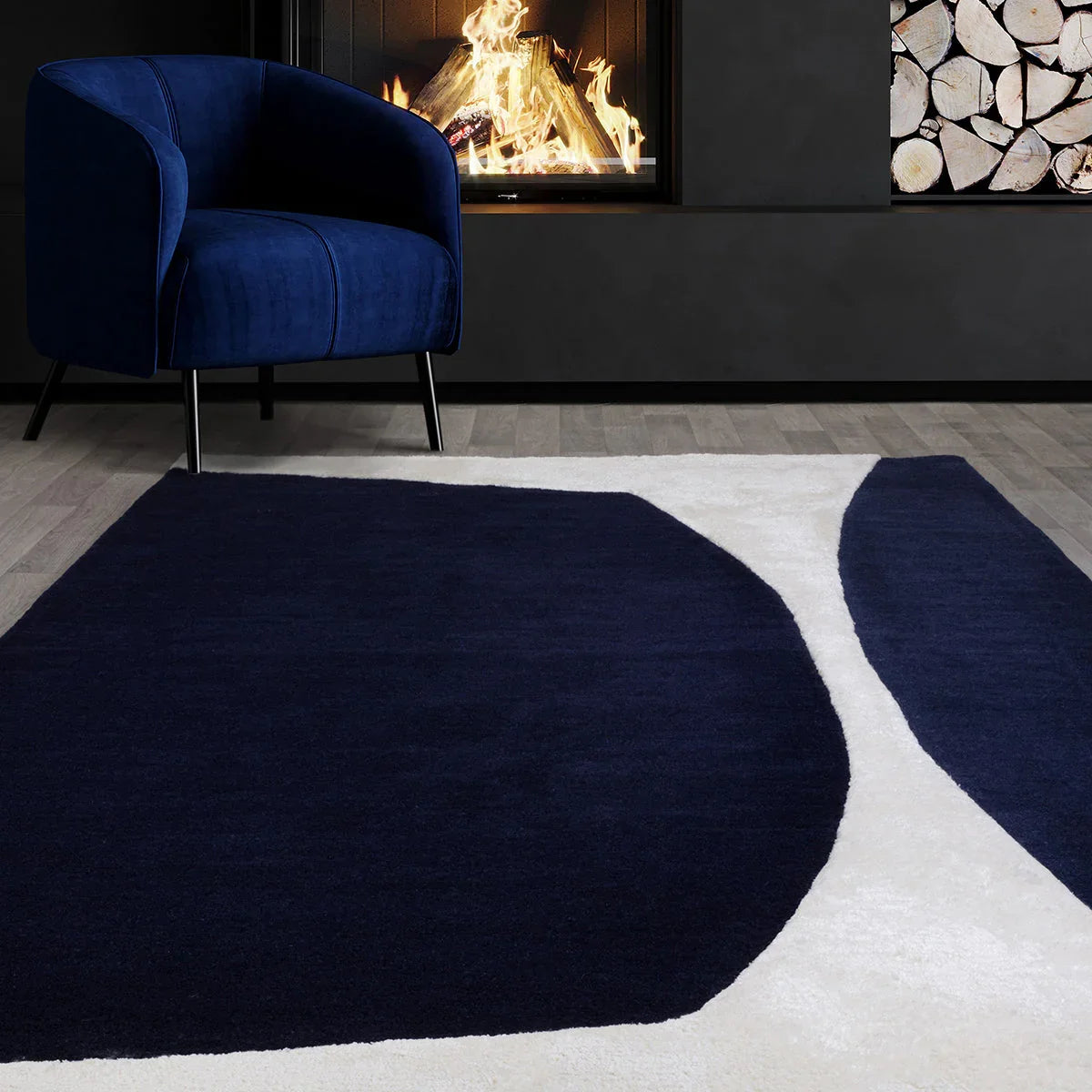 Asiatic Matrix Signature Indigo Designer Rug featuring abstract curved pattern in navy indigo and white on cream background, wool