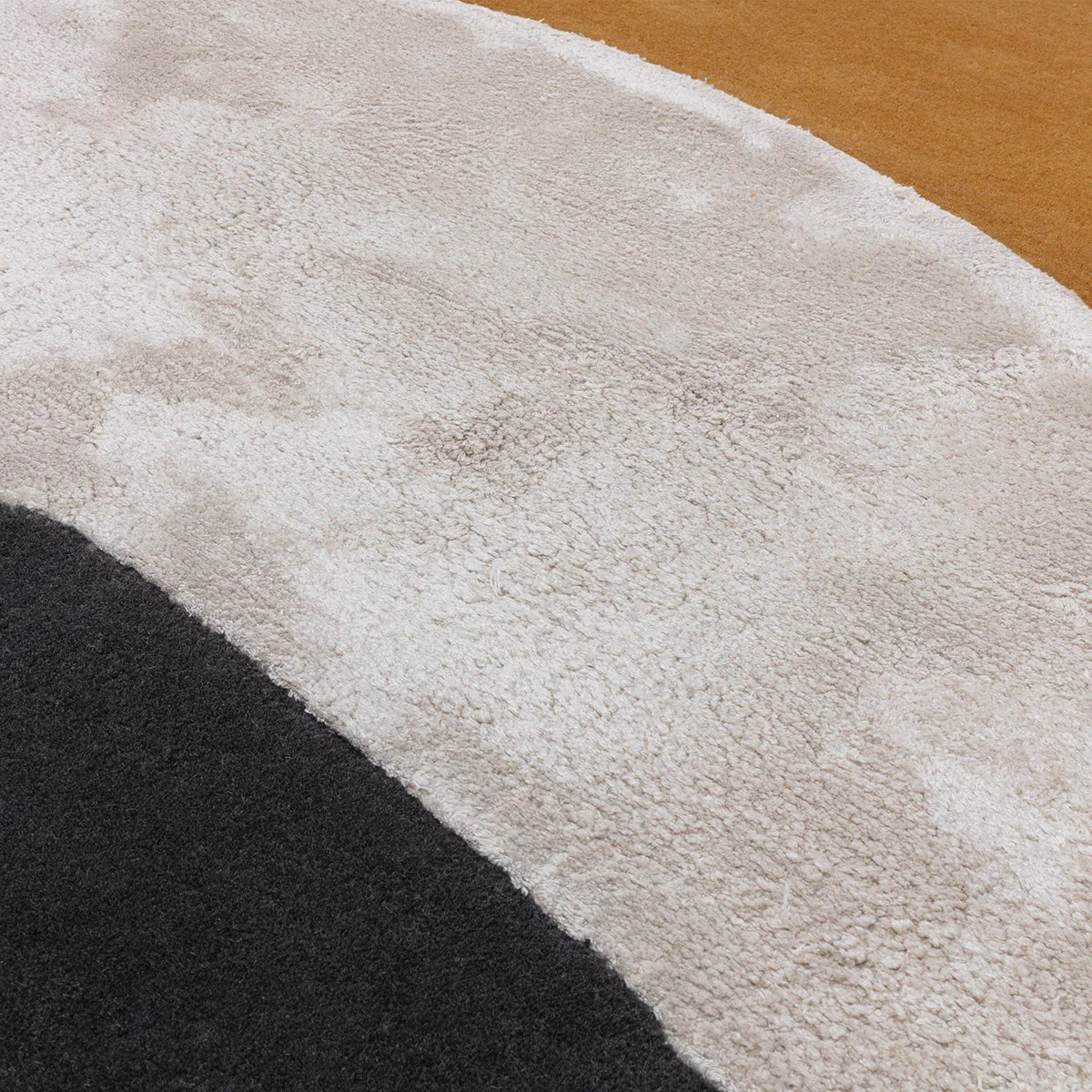 Asiatic Matrix Signature Ochre Designer Rug featuring abstract curved pattern in ochre, cream and charcoal on beige background, hand-tufted wool