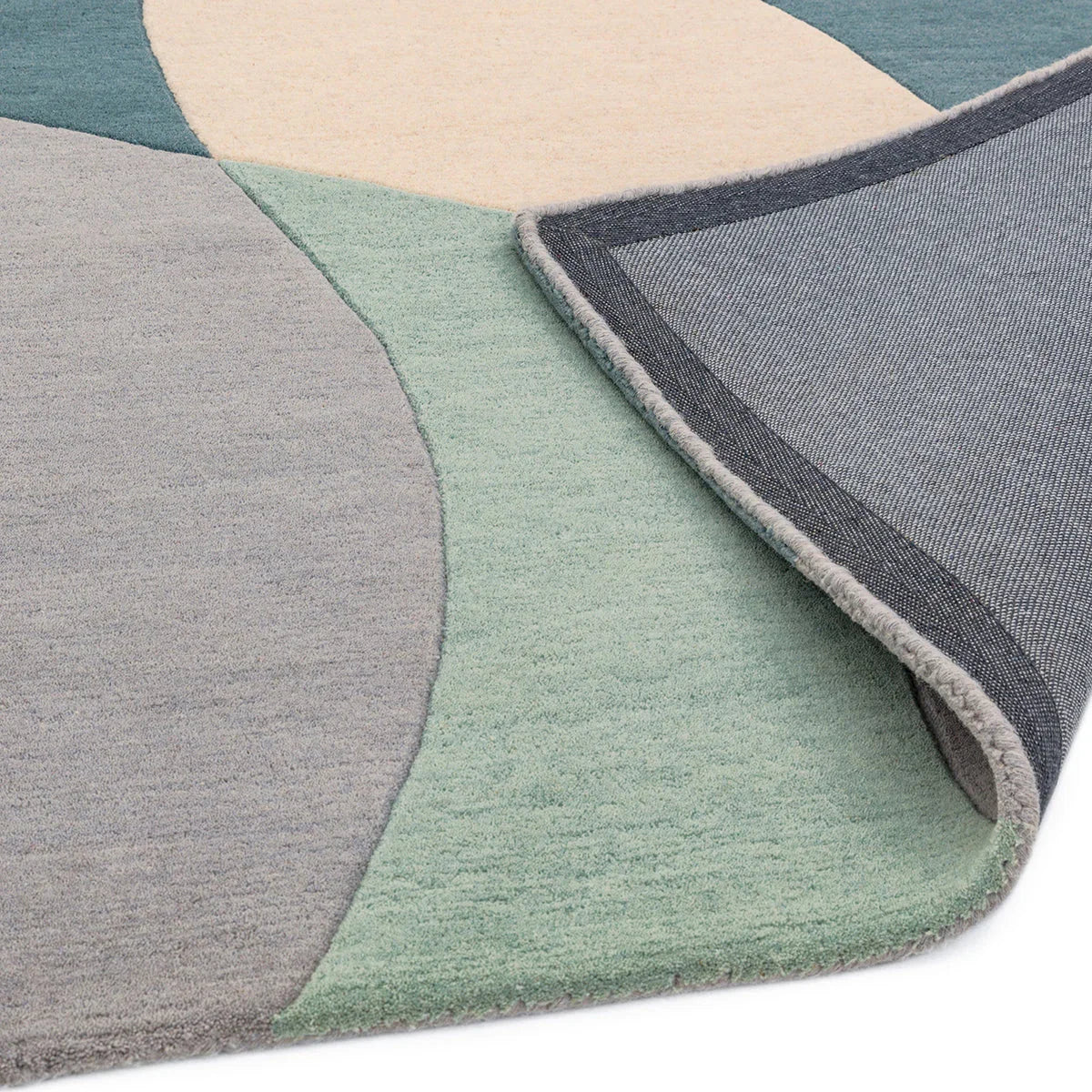 Asiatic Matrix Max Arc Sky Rug featuring abstract arc pattern in navy, teal, sage green, beige and grey on cream background, machine-loomed pile