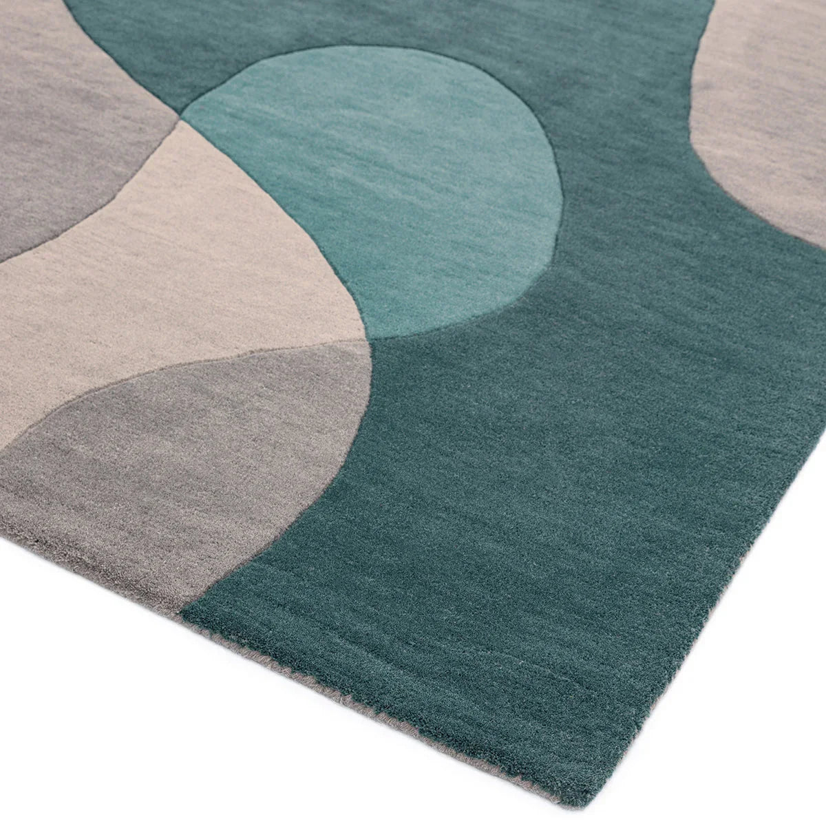 Asiatic Matrix Max Arc Teal rug featuring abstract arc pattern in teal, turquoise, beige and grey on teal background, machine-made wool