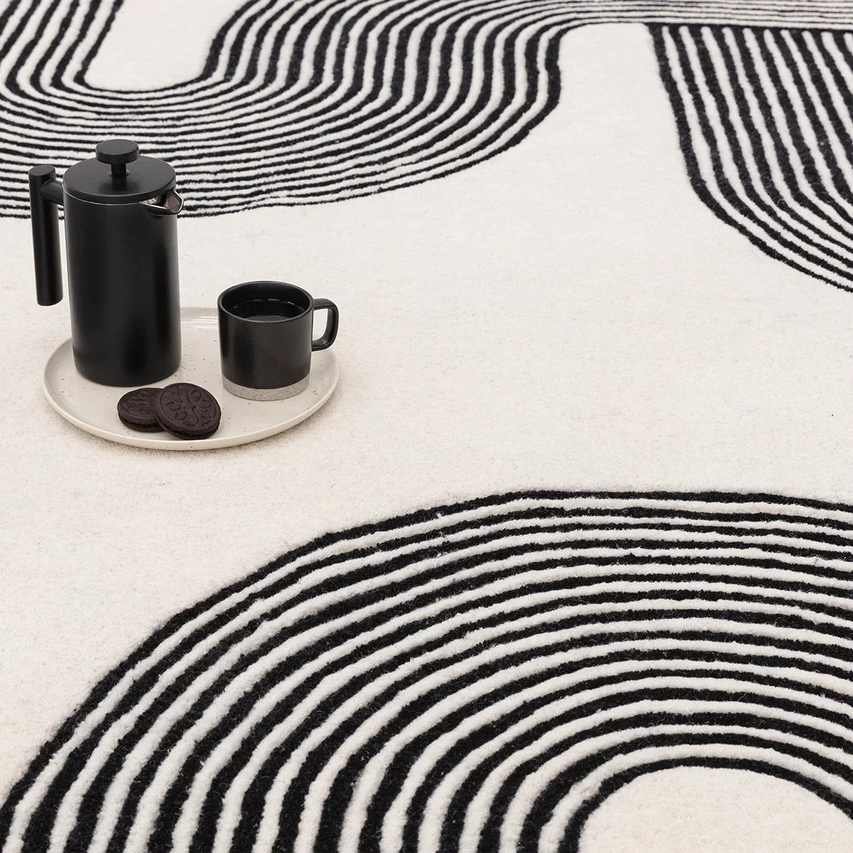 Asiatic Matrix Arches Black Designer Rug featuring arches geometric pattern in black and white on ivory background, hand-tufted wool