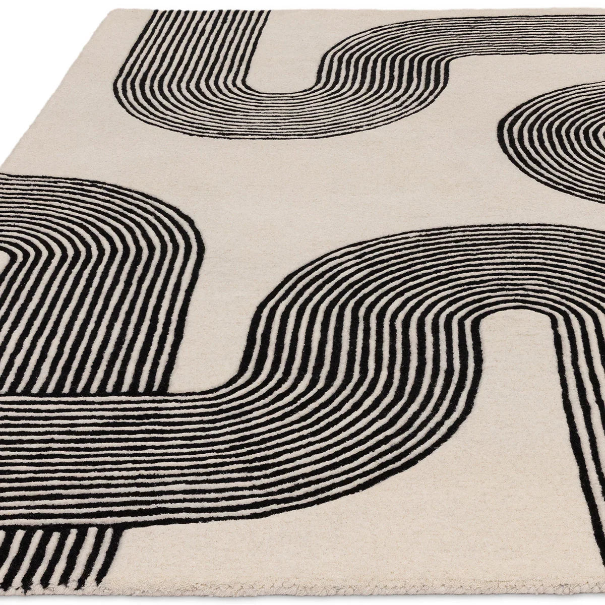 Asiatic Matrix Arches Black Rug featuring arch pattern in black on cream background, machine-made wool