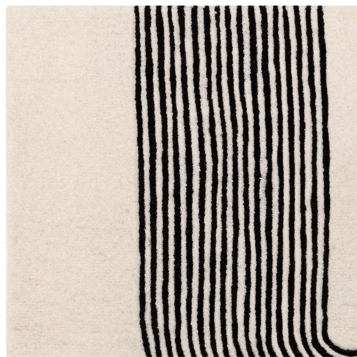 Asiatic Matrix Arches Black Designer Rug featuring geometric striped arch pattern in black on cream-beige background, hand-tufted wool