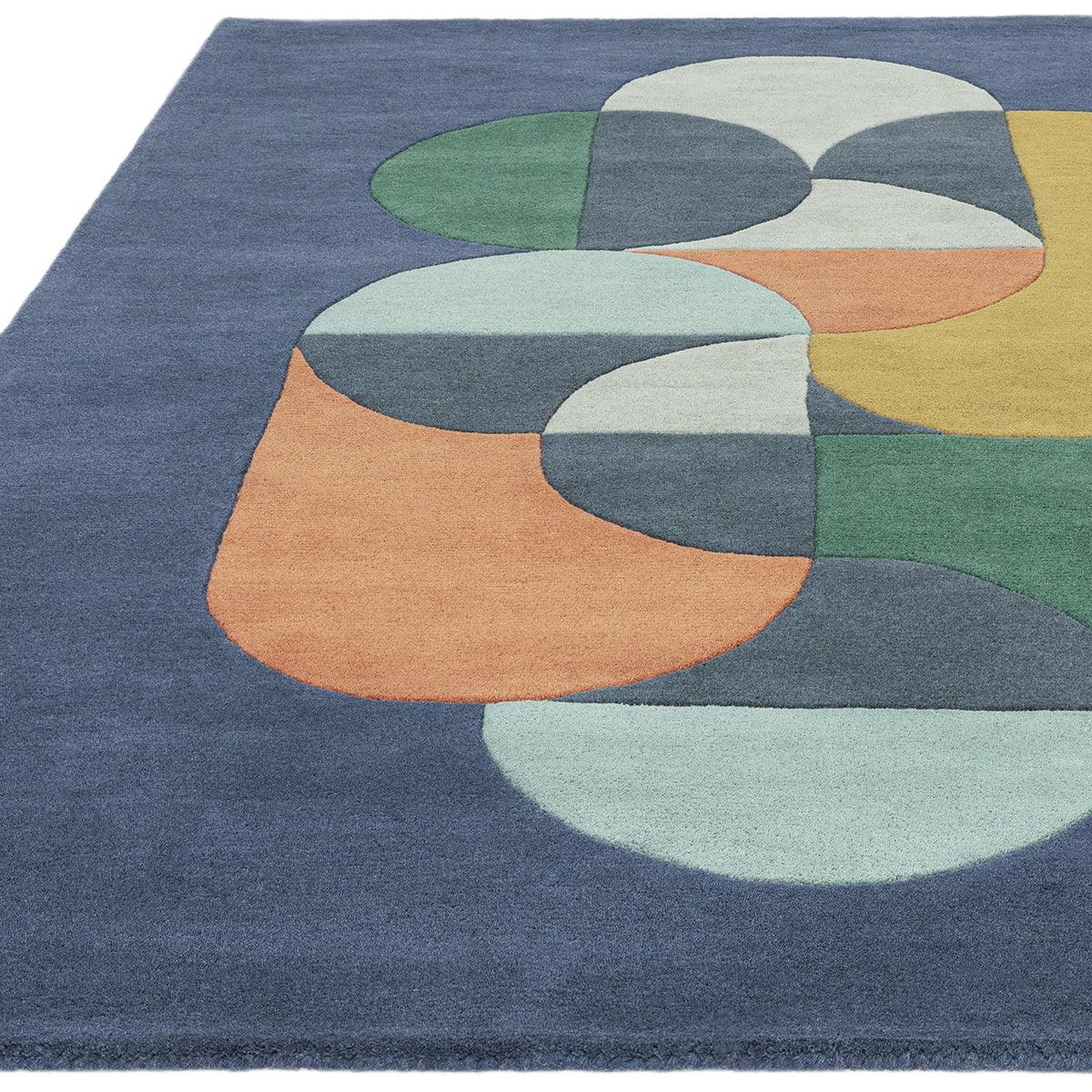 Asiatic Matrix 91 rug featuring abstract geometric shapes in navy, teal, sage, coral and cream on navy background, wool