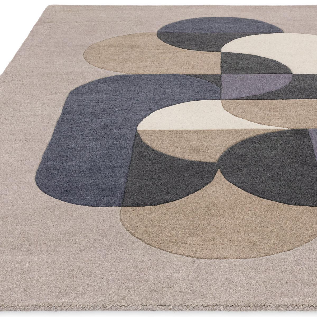 Asiatic Matrix 92 Rug featuring circular pattern in navy blue, taupe, cream, beige and dusty lilac on light grey background