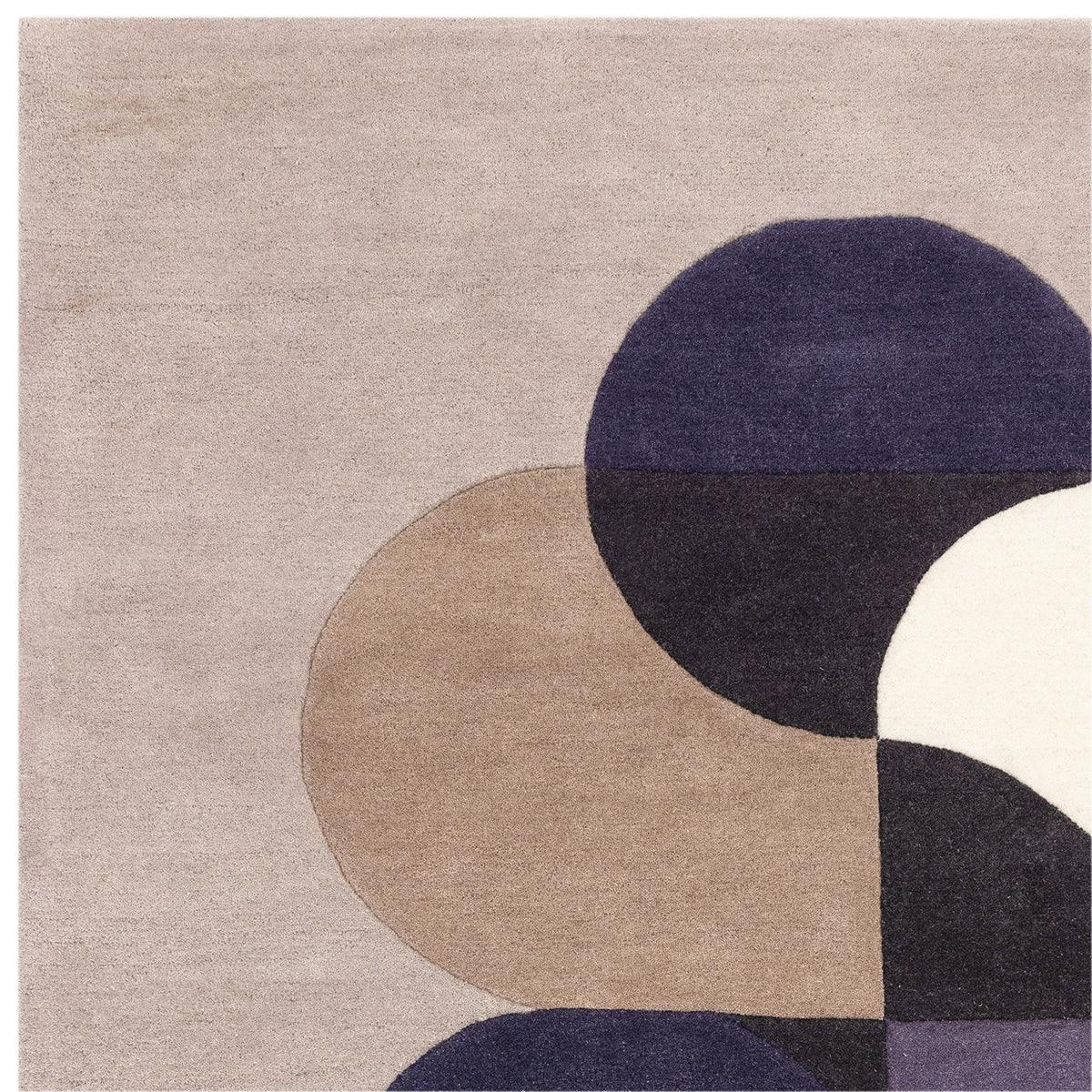 Asiatic Matrix 92 Rug featuring abstract circular geometric pattern in navy, taupe, cream on light grey background