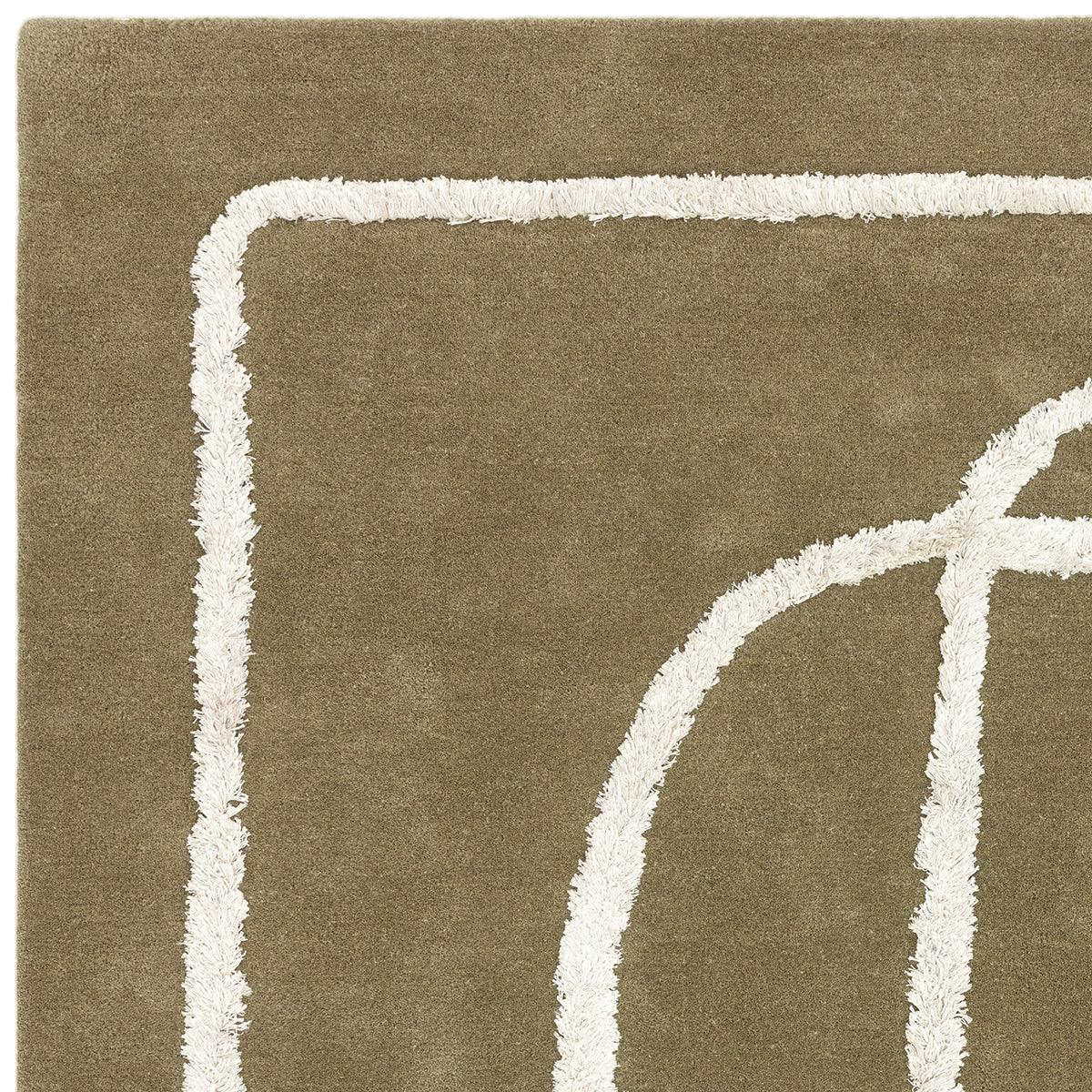 Asiatic Matrix Infinity Sage Designer Rug featuring abstract geometric pattern in sage-green and cream on olive background, hand-tufted wool