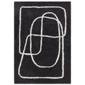Black rug with white abstract patterns on a plain background