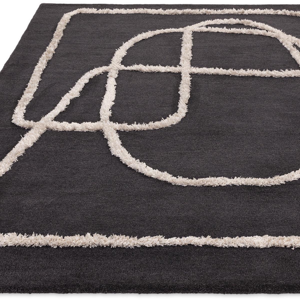 Asiatic Matrix Infinity Charcoal Designer Rug featuring abstract loop pattern in cream on charcoal background, machine-made polyester