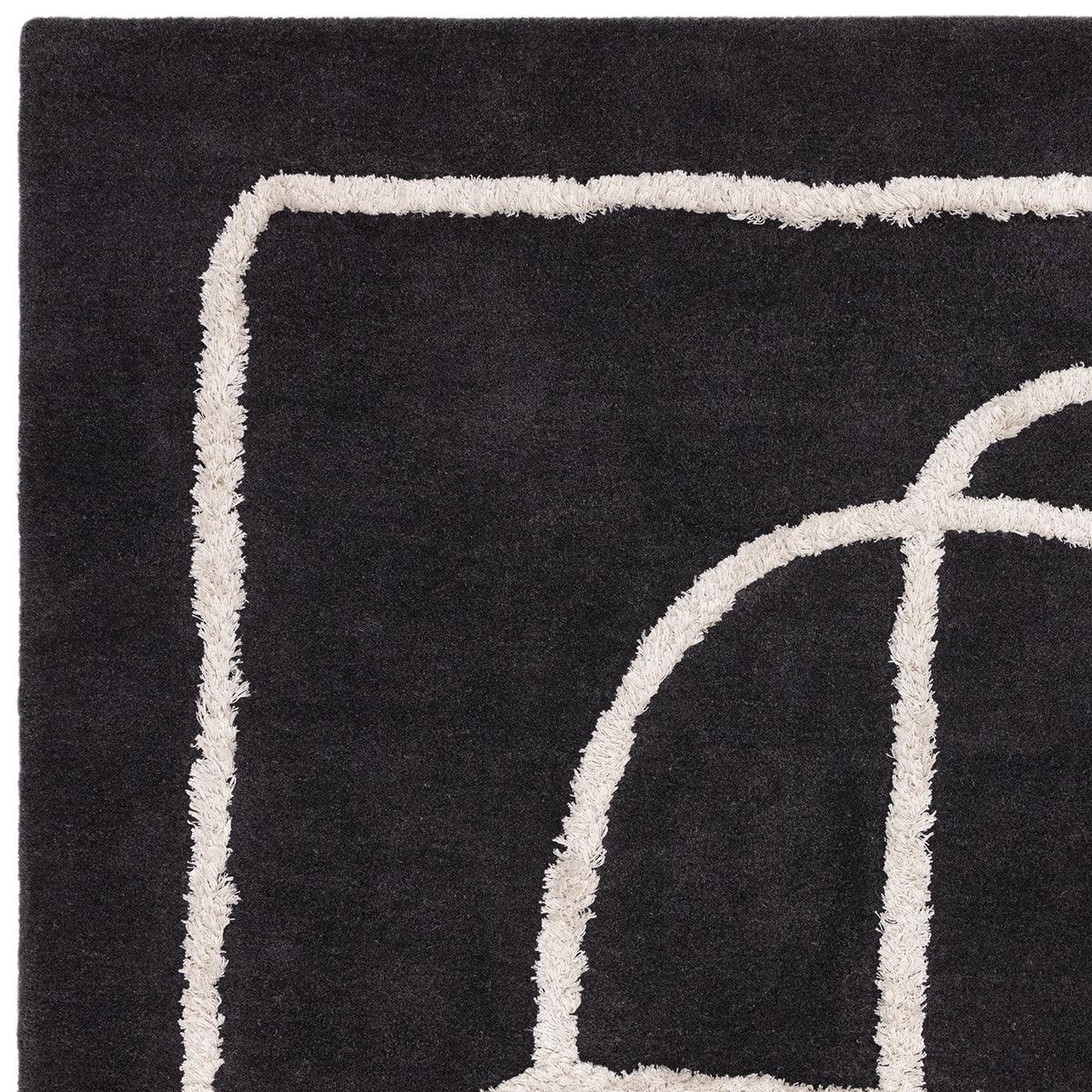 Asiatic Matrix Infinity Charcoal Designer Rug featuring abstract curved cream lines on charcoal background