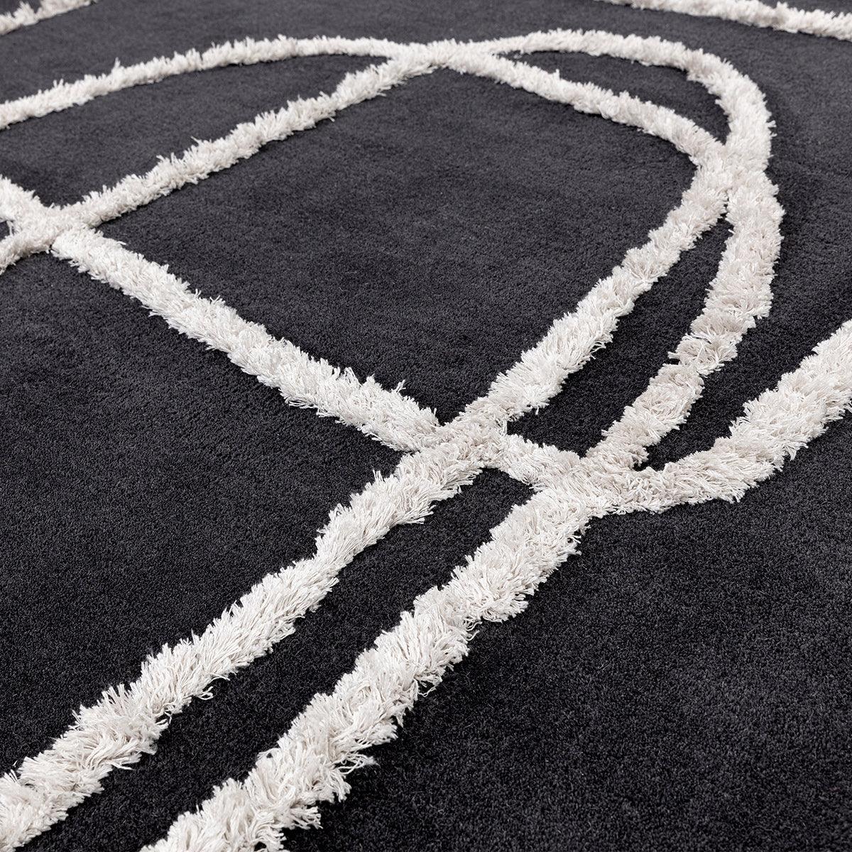 Asiatic Matrix Infinity Charcoal Designer Rug featuring abstract geometric pattern in white on charcoal background, machine-made polypropylene