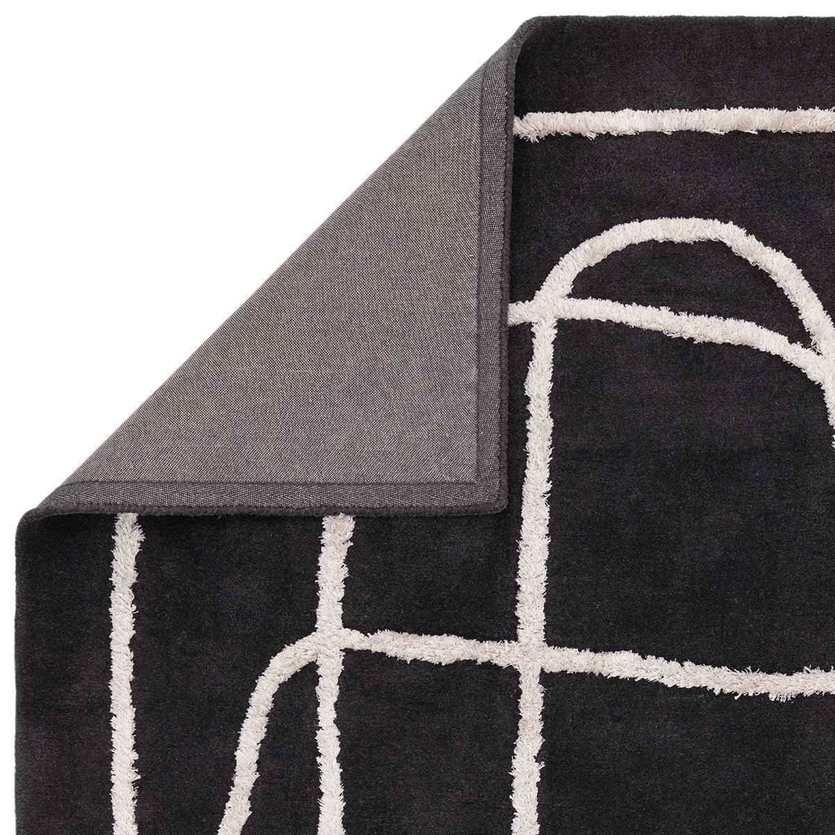 Asiatic Matrix Infinity Charcoal Designer Rug featuring geometric grid pattern in ivory on charcoal background, machine-woven polypropylene blend