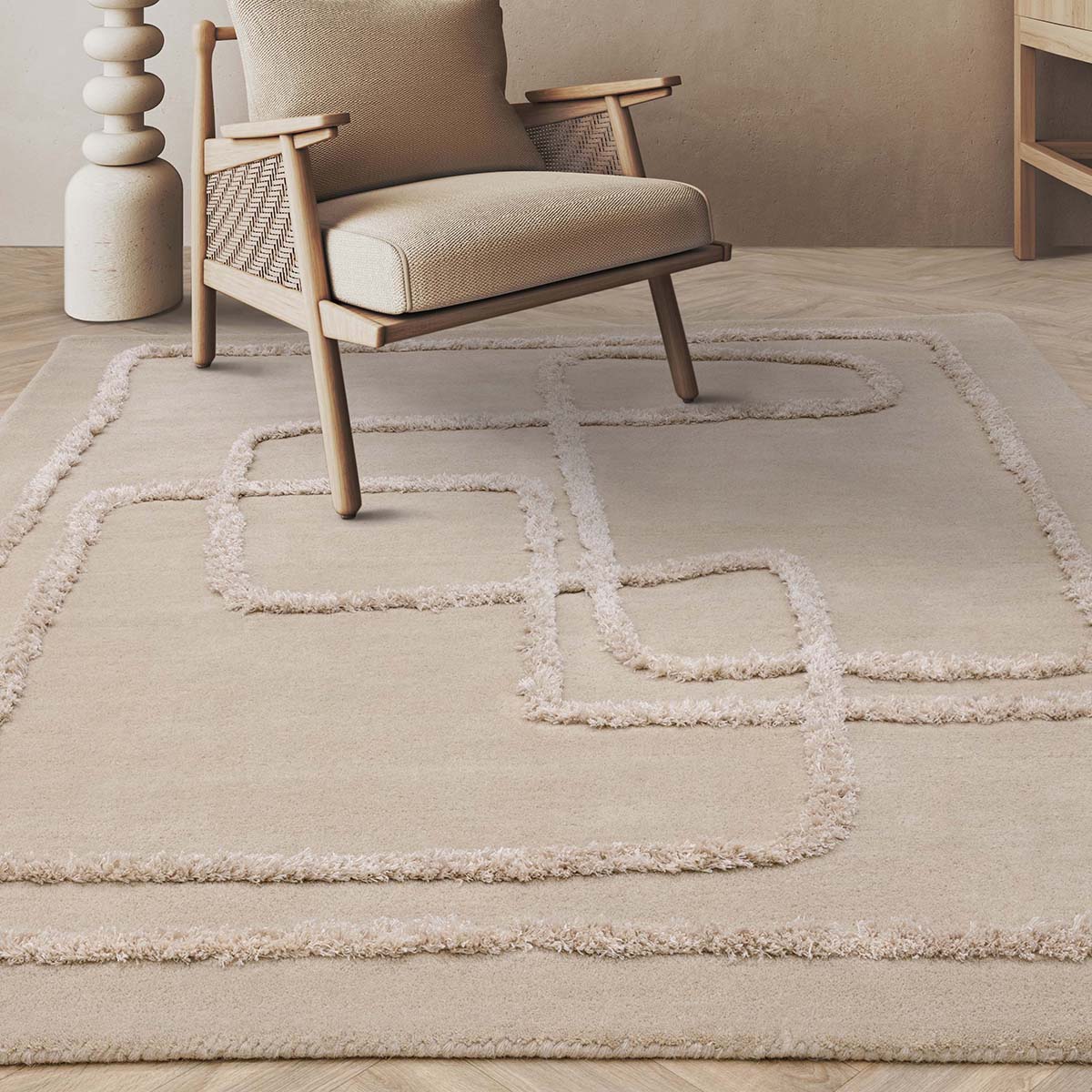 Beige rug with geometric pattern in a room with a wooden chair.