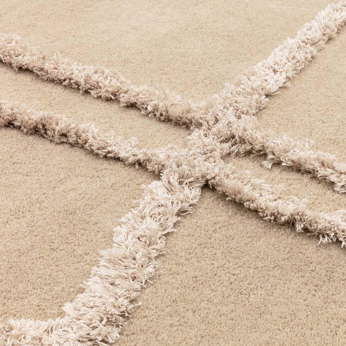 Asiatic Matrix Infinity Sand Designer Rug featuring abstract intersecting shaggy bands in sand beige and cream on warm beige, hand-tufted wool