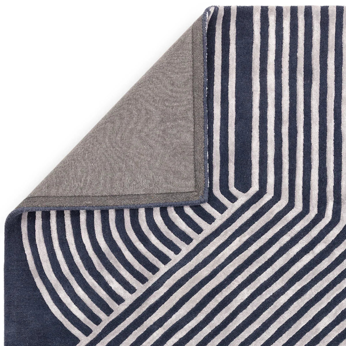 Asiatic Matrix Solstice Navy Rug featuring striped geometric pattern in navy and ivory on cream background, machine-woven wool