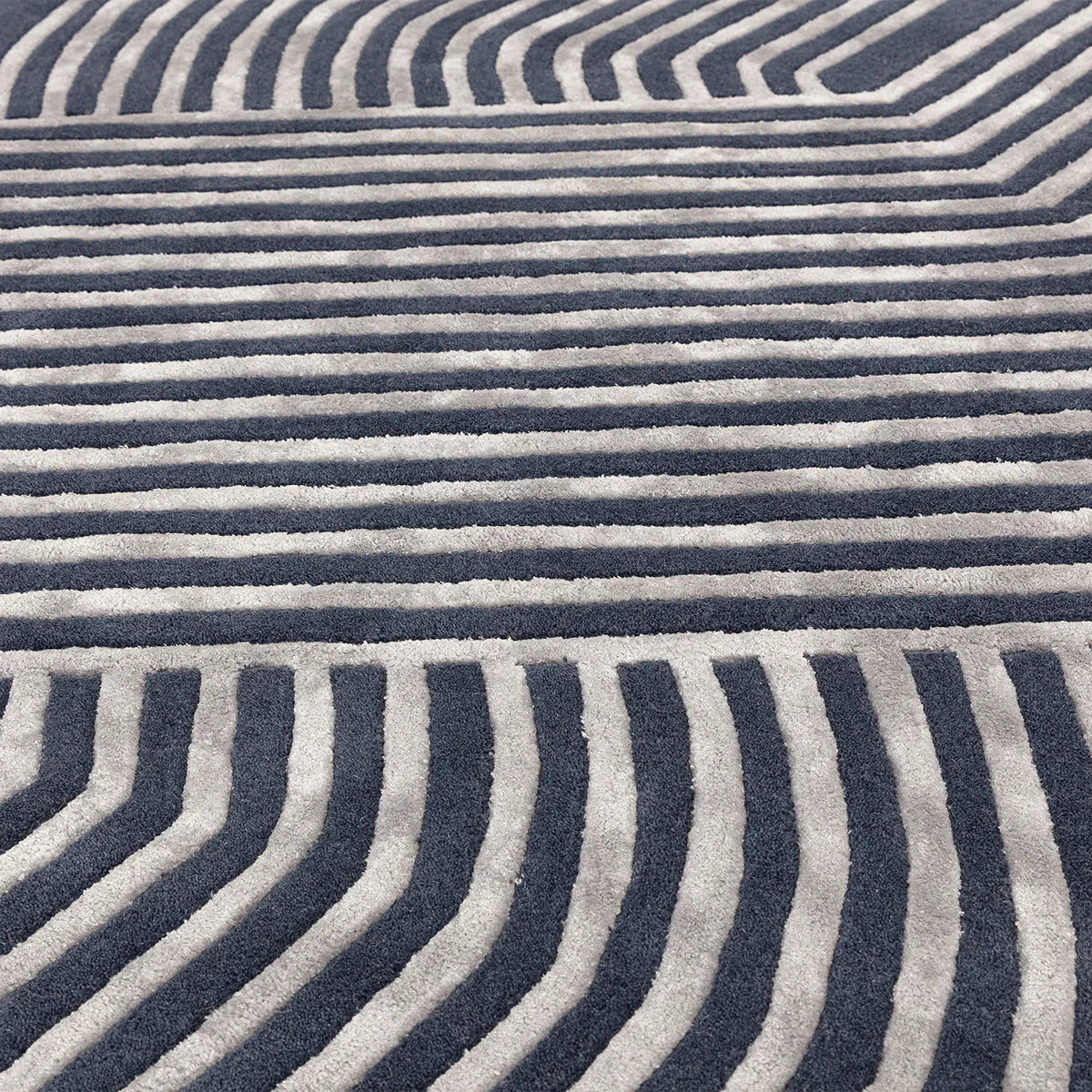 Asiatic Matrix Solstice Navy Designer Rug featuring geometric striped pattern in navy and light grey on ivory background, hand-tufted wool