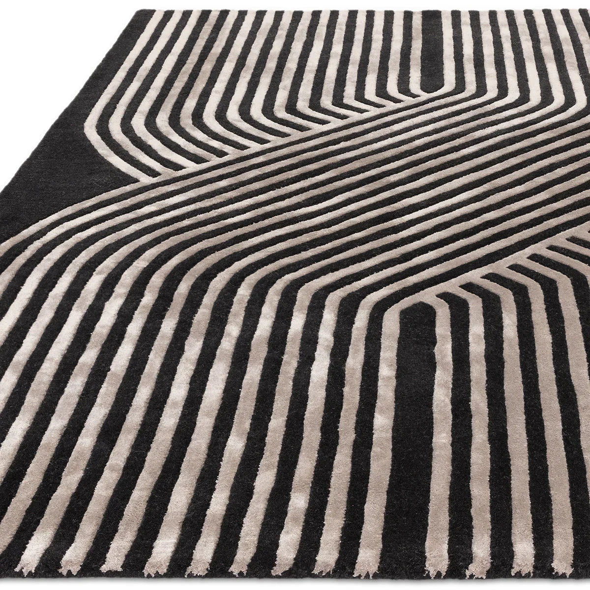 Asiatic Matrix Solstice rug featuring bold linear geometric pattern in gunmetal and ivory on black background, machine-woven wool