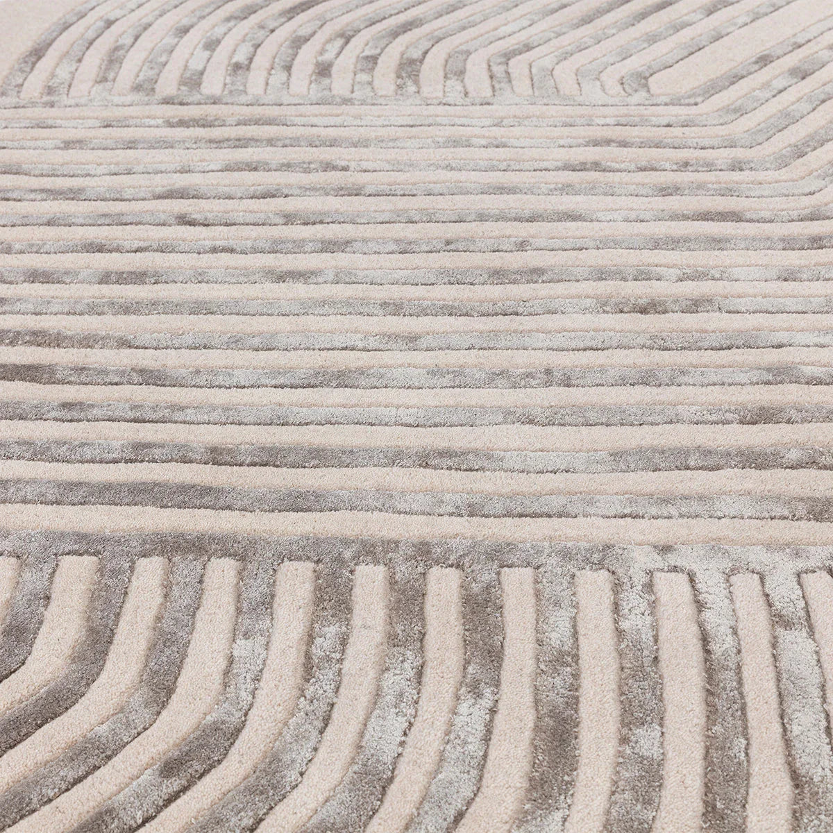 Asiatic Matrix Solstice Ivory rug featuring abstract wavy stripe pattern in ivory, beige, taupe and grey on ivory background, machine-made wool