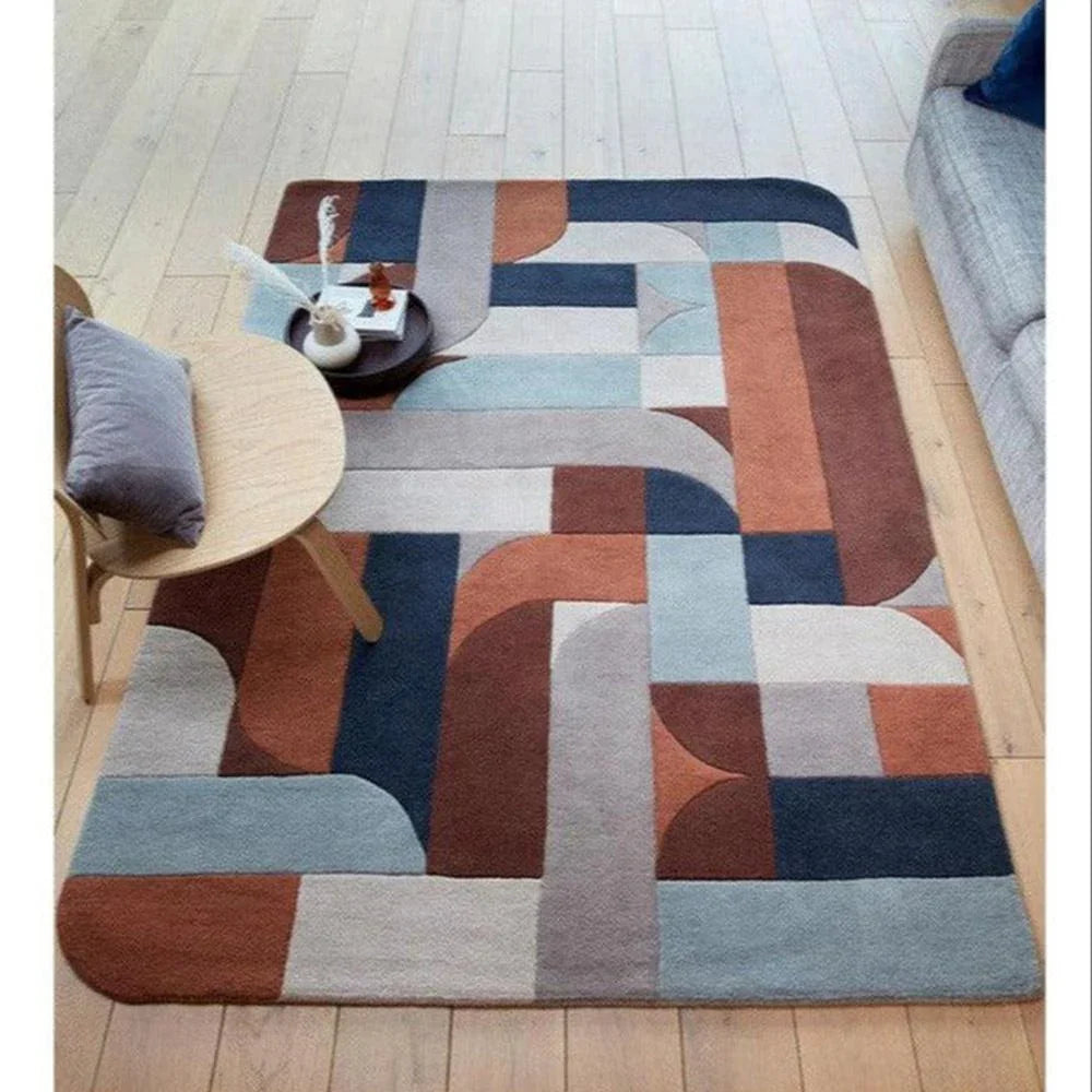 Asiatic Klotski Terracotta Designer Rug featuring geometric block pattern in terracotta, navy, light blue, cream and grey on wood floor, machine-made