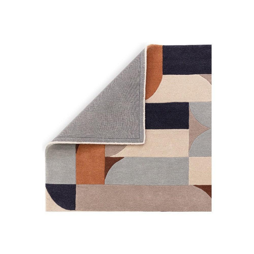 Asiatic Klotski Terracotta Rug with geometric blocks in terracotta, navy, beige and grey on cream background, tufted wool