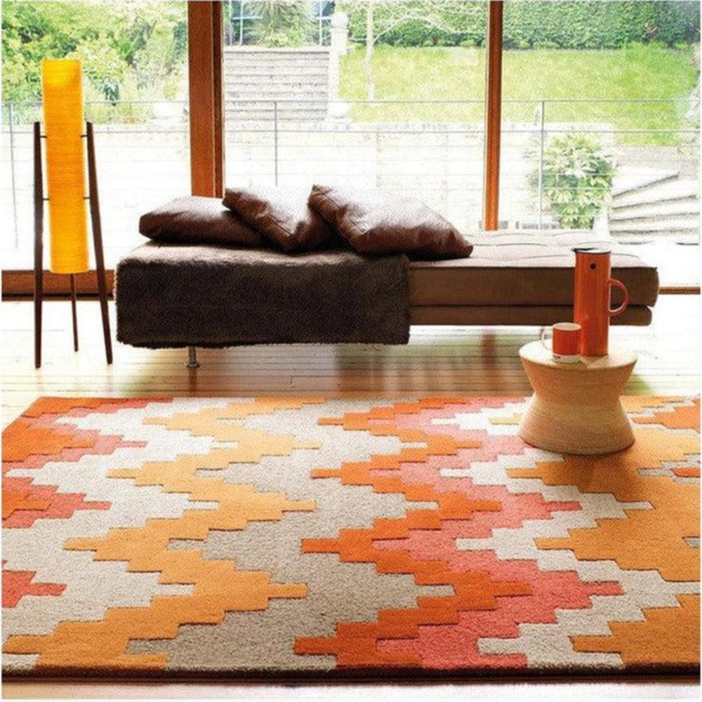 Asiatic Cuzzo Sienna Designer Rug featuring geometric zigzag in burnt orange, sienna, peach and cream on cream background, hand-tufted wool