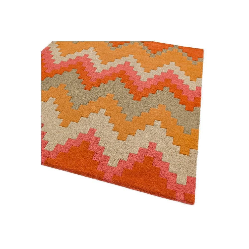 Asiatic Cuzzo Sienna Designer Rug featuring zigzag chevron pattern in orange, coral pink, beige on cream background, hand-tufted wool
