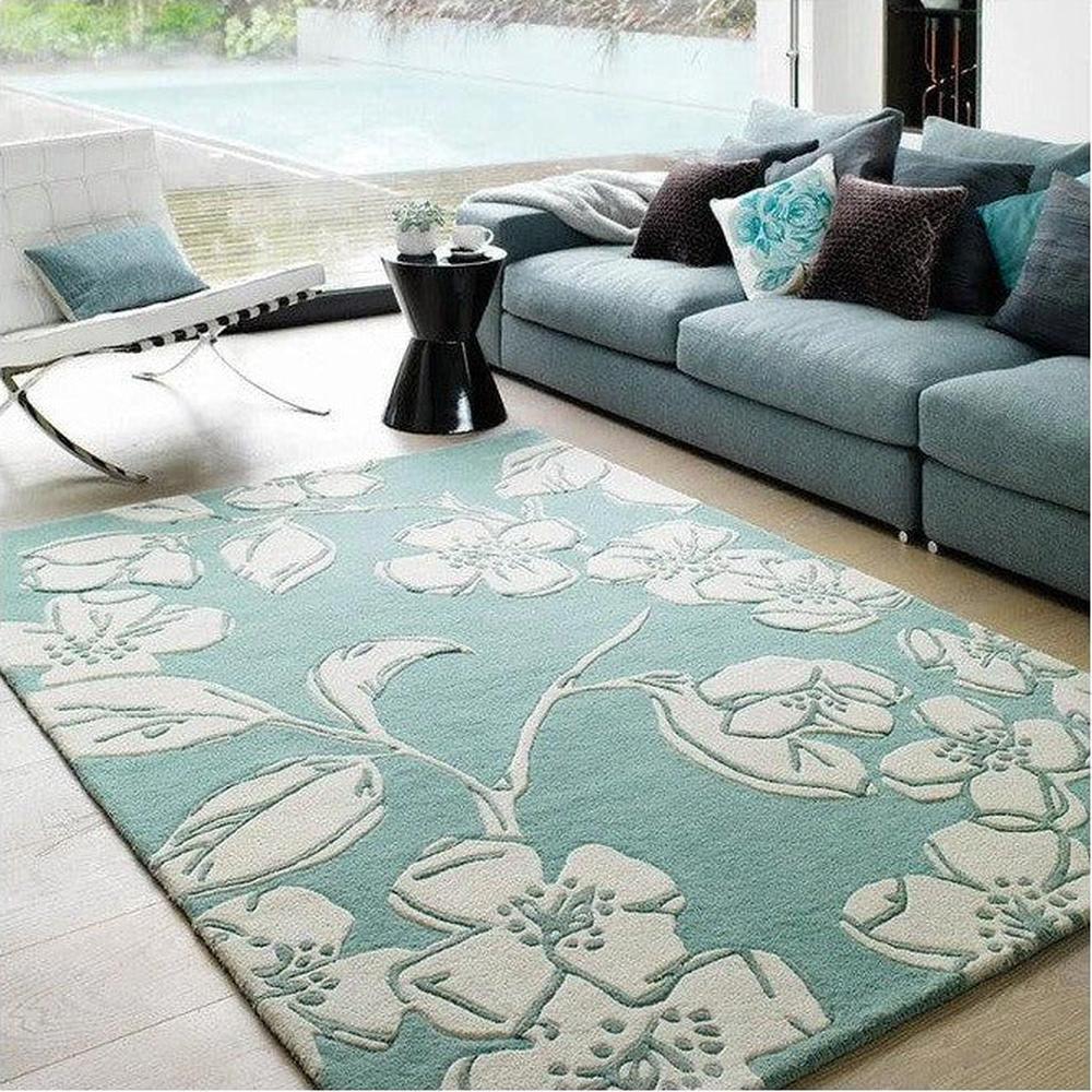 Asiatic Devore Blue Designer Rug featuring large white floral pattern in teal on teal background, machine-made rug