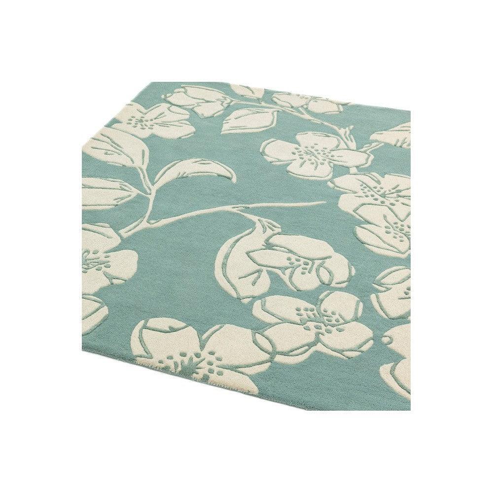 Asiatic Devore Blue Designer Rug by Asiatic London featuring ivory floral pattern on teal background, machine-made.