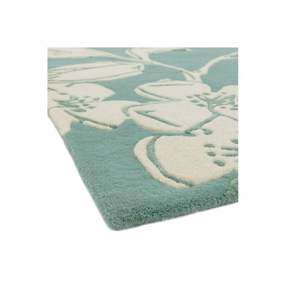 Asiatic Devore Blue Designer Rug featuring cream floral/abstract motif on teal background, hand-tufted wool