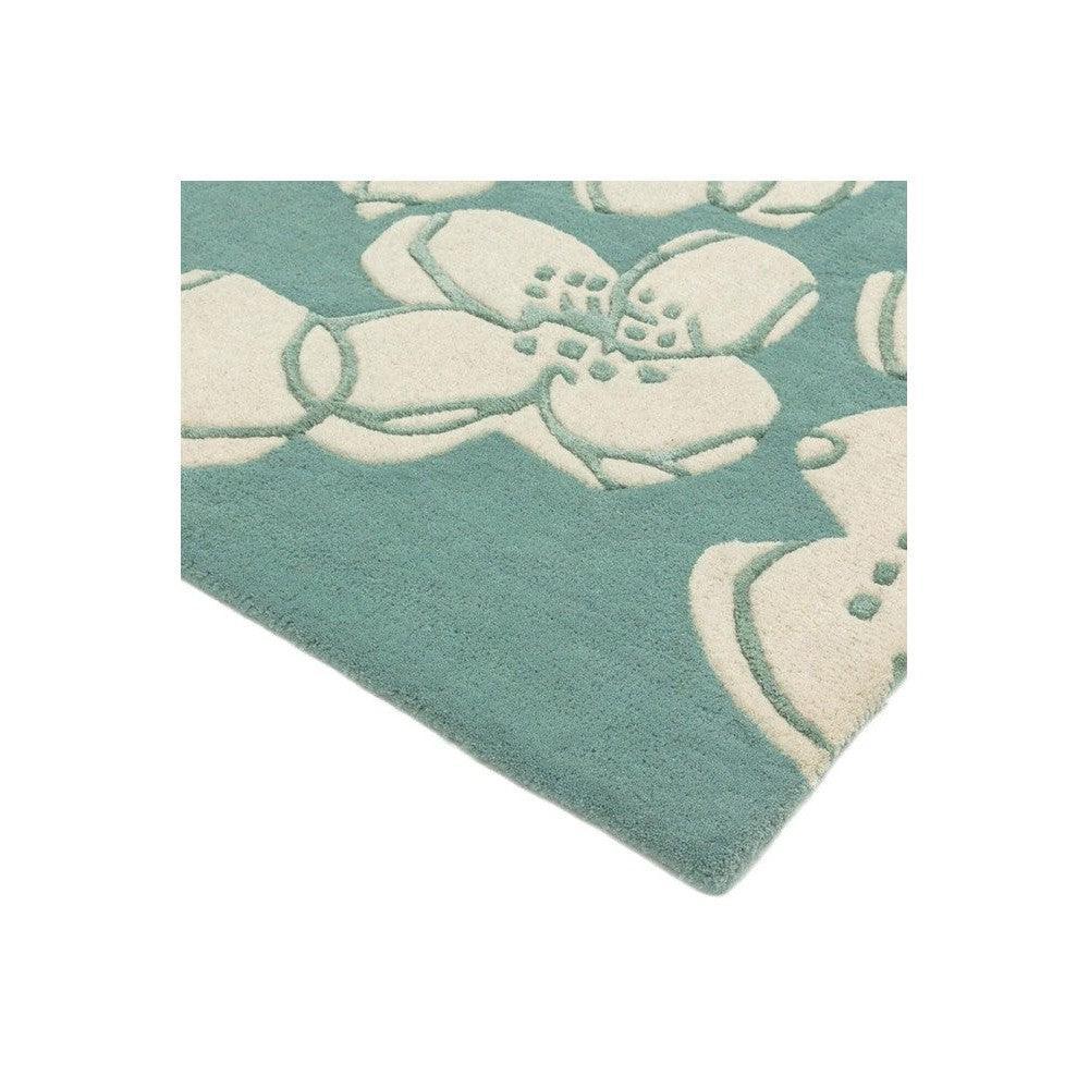Asiatic Devore Blue Designer Rug featuring botanical floral pattern in teal and cream on teal background, machine-made polypropylene