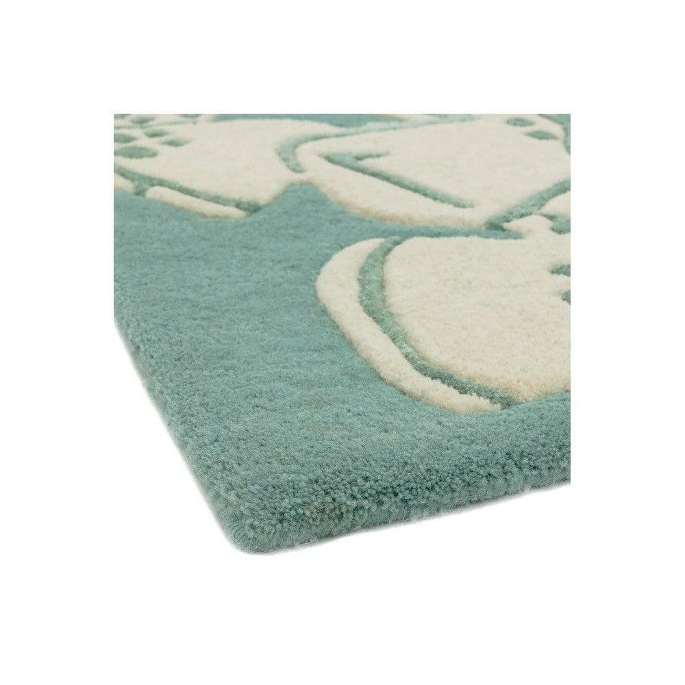 Asiatic Devore Blue Designer Rug featuring abstract cream shapes on teal blue background