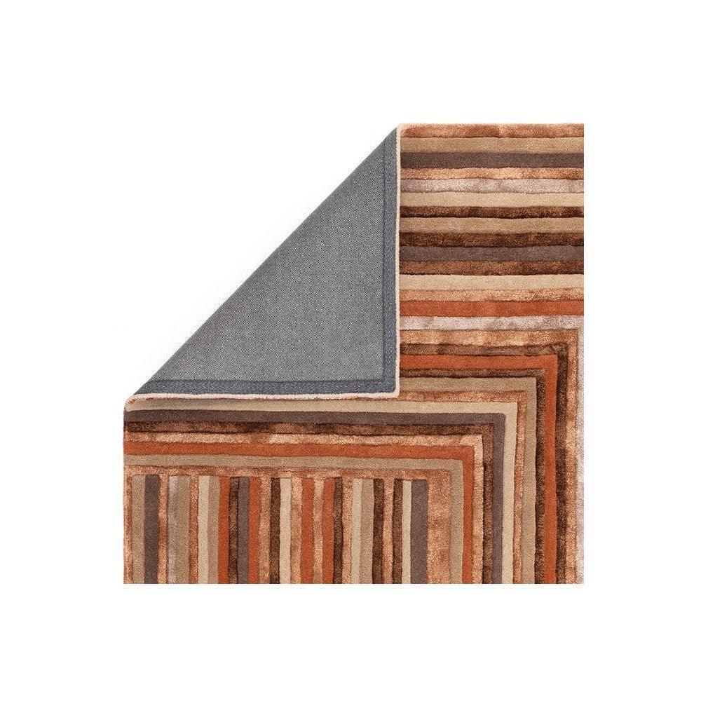 Asiatic Network Terracotta Designer Rug featuring striped geometric border in terracotta, brown, beige on blue backing, hand-tufted wool