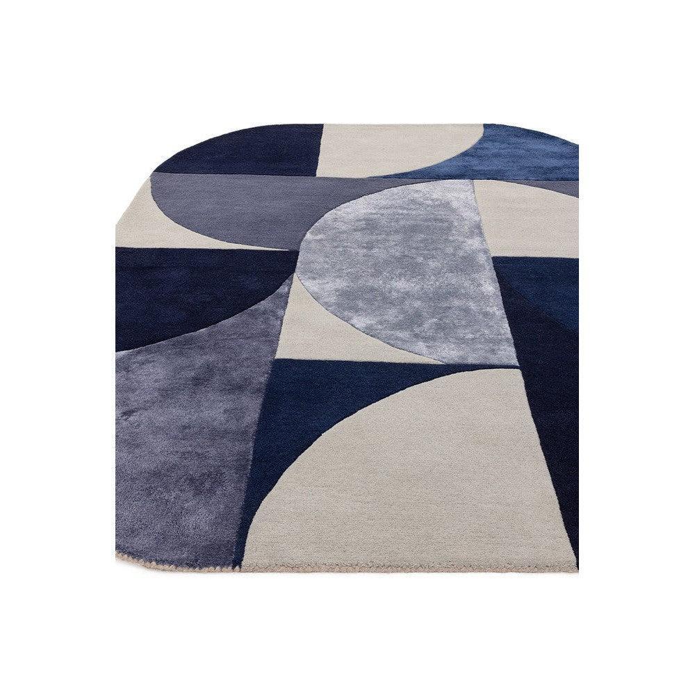 Asiatic Oval Indigo Designer Rug featuring abstract curved geometry in navy, indigo, grey and beige on beige background, hand-tufted wool