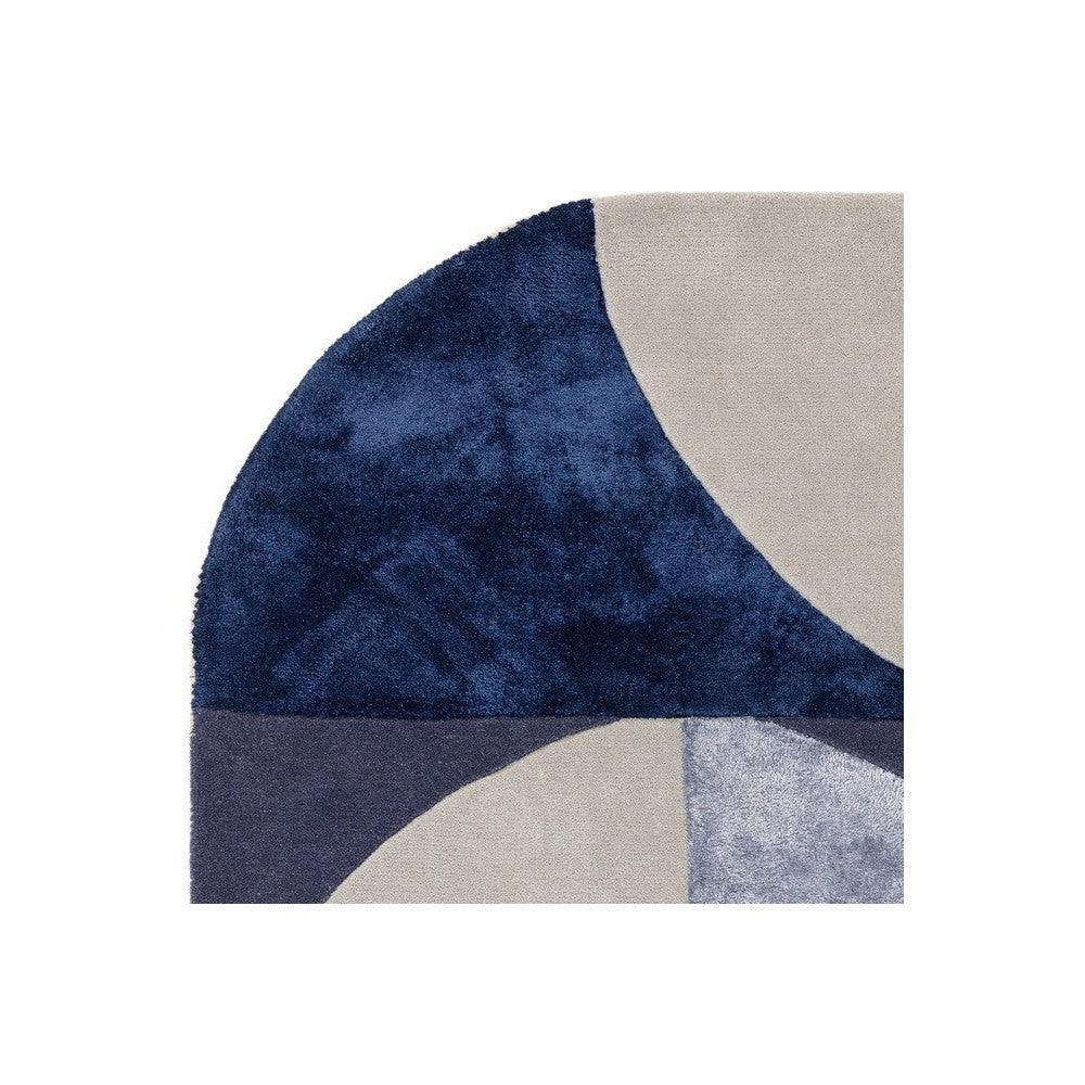 Asiatic Oval Indigo Designer Rug featuring geometric abstract pattern in navy, beige, taupe and light grey on cream background, hand-tufted wool
