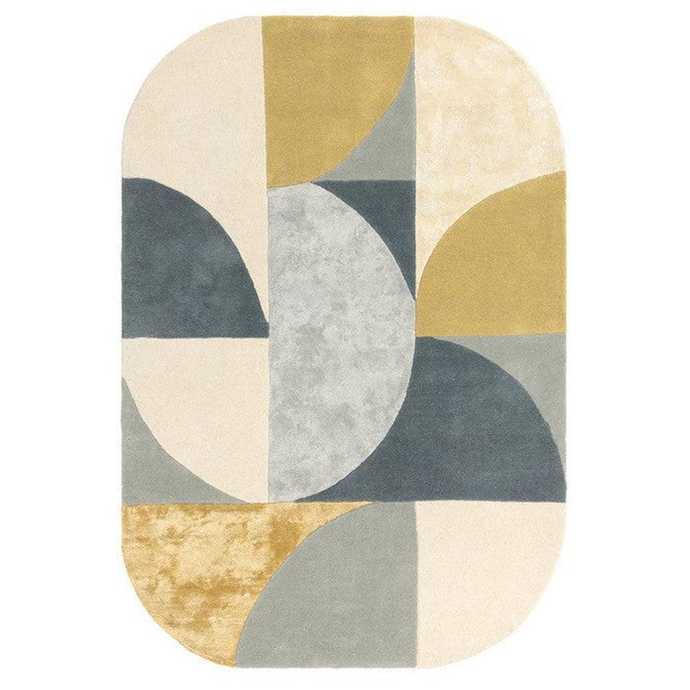 Asiatic Oval Sunset Rug featuring geometric patchwork in cream, beige, mustard, navy and grey on ivory background, hand-tufted wool