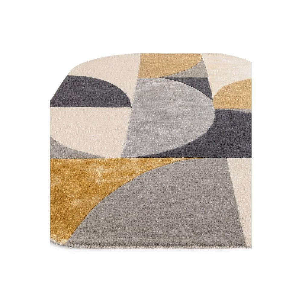 Asiatic Oval Sunset Rug featuring geometric abstract pattern in beige, grey, charcoal and ochre on cream background, hand-tufted wool