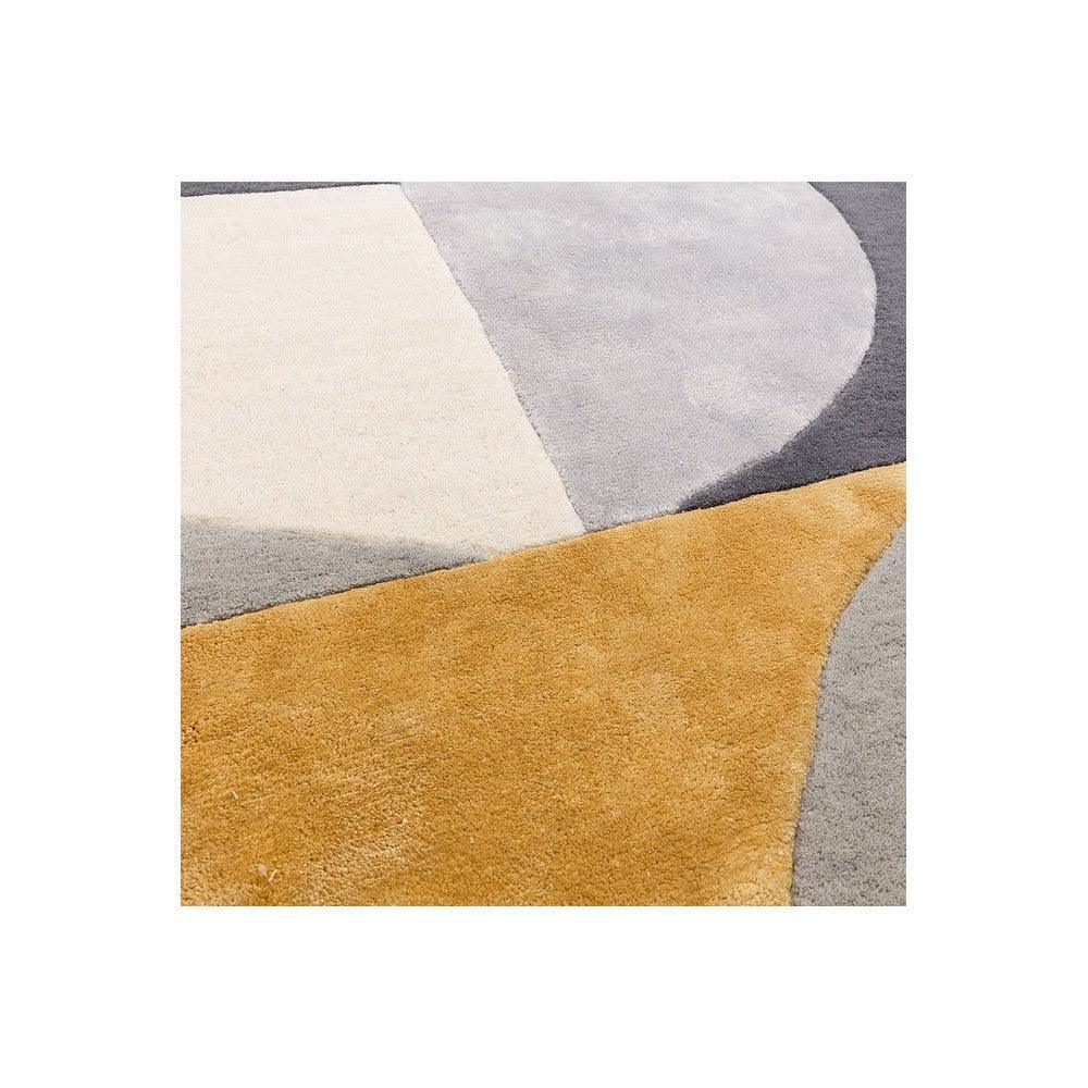Asiatic Oval Sunset Designer Rug featuring abstract geometric blocks in mustard, cream, light grey and charcoal on beige background, hand-tufted wool